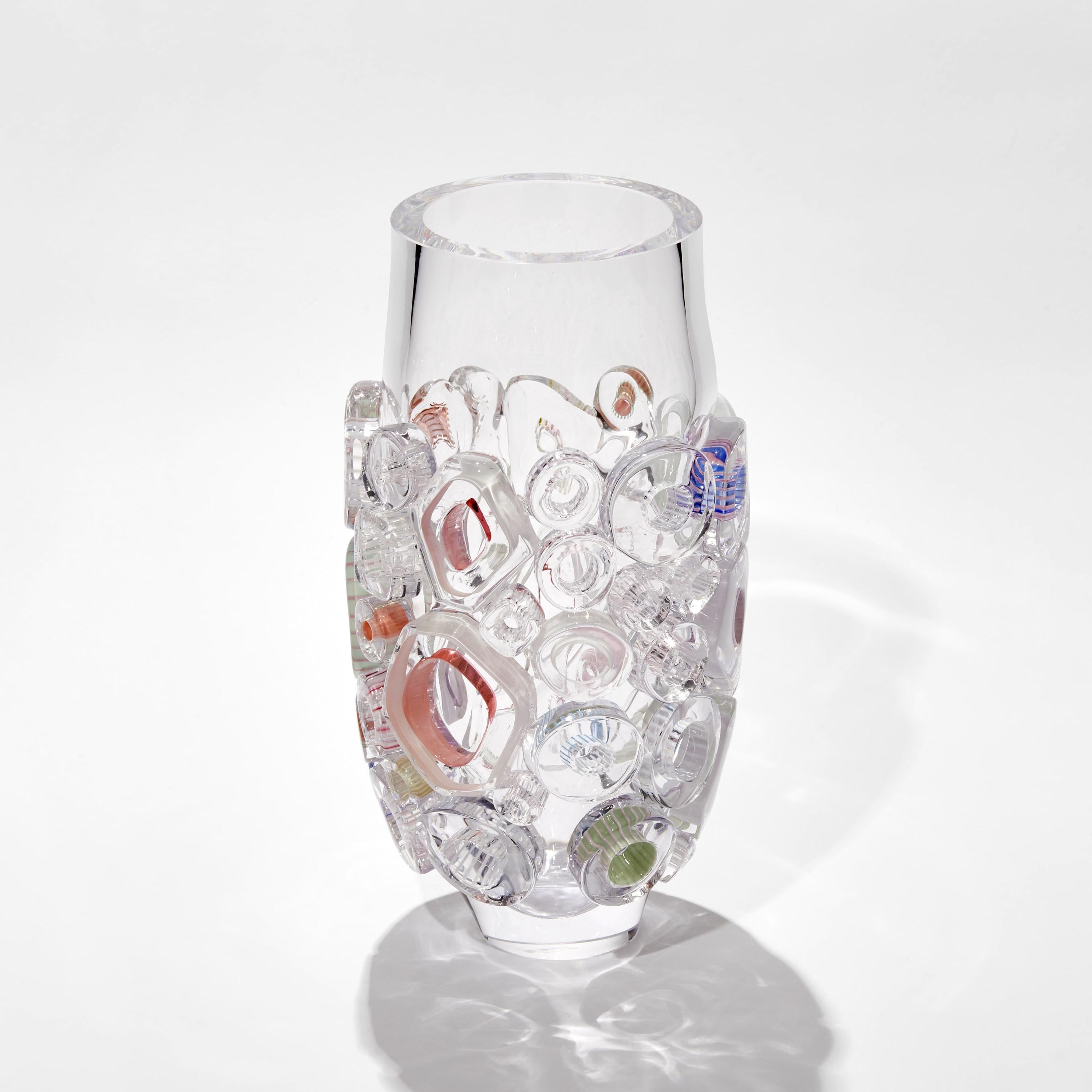 ‘Bright Field Clear’ is a unique sculptural glass vase by the German artist, Sabine Lintzen.

The initial inner form is free-blown and adorned with various individually shaped murrini. The top edge had been cut and polished to create a beautiful