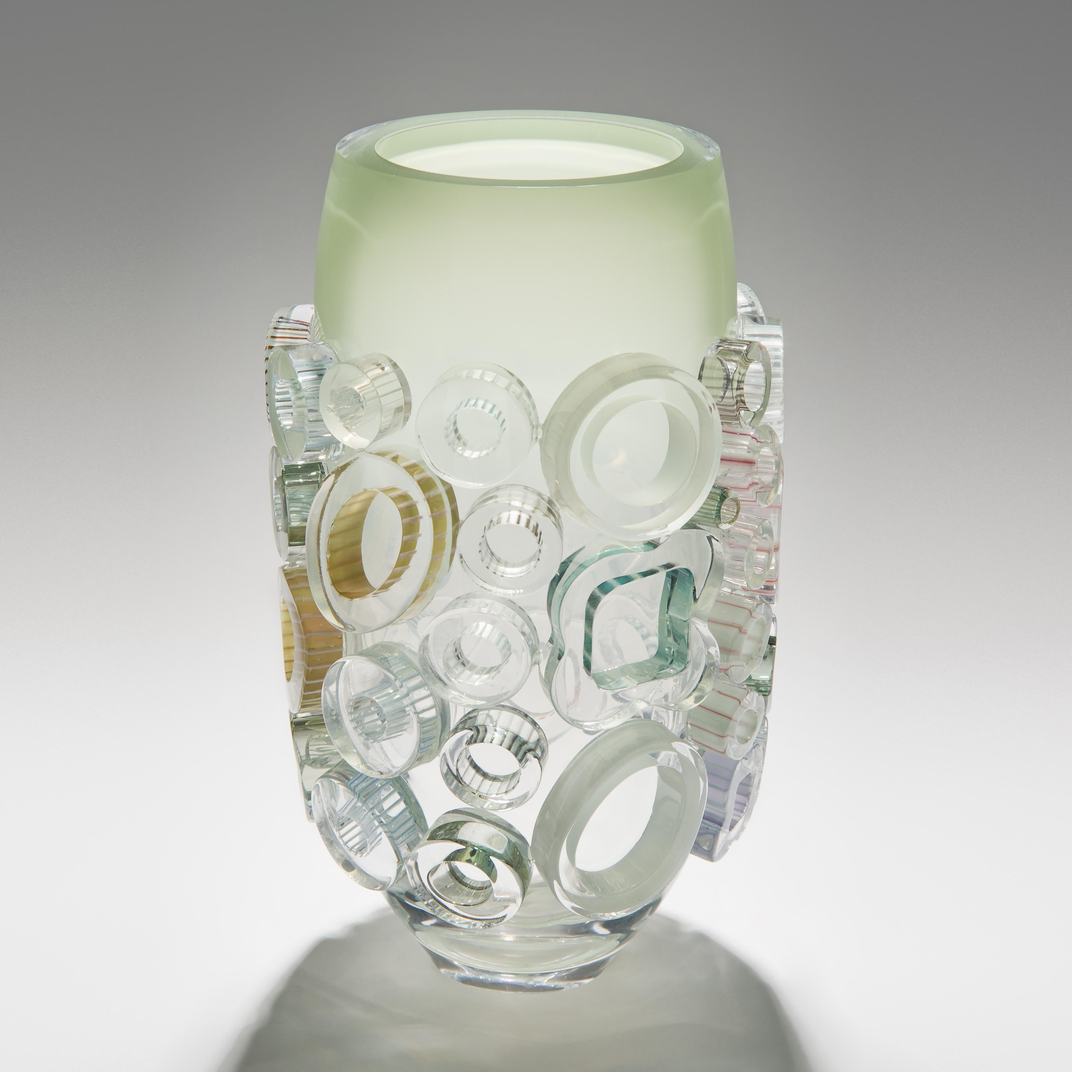 Bright field Isar Green is a unique hand blown and crafted vase by the German artist, Sabine Lintzen. The initial inner form is free-blown and adorned with various individually shaped murrini, all created in a mix of colored glass in celadon, green,