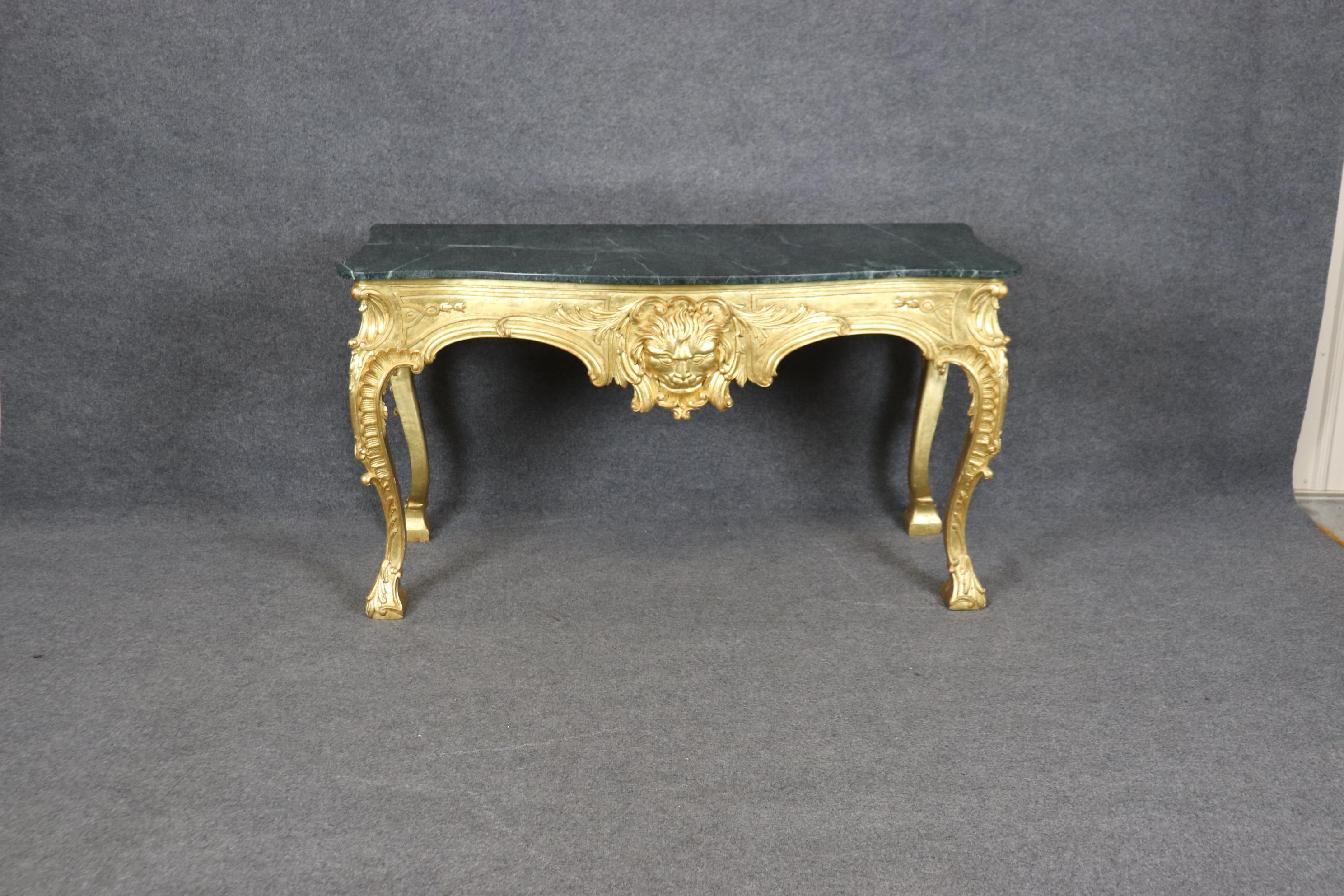 This is a spectacular custom-made and hand gilded 18kt genuine gold leaf over Italian red bole clay ground. The former owner has this table made in England and was in fact England and paid dearly for the size and quality to make it. The table is in