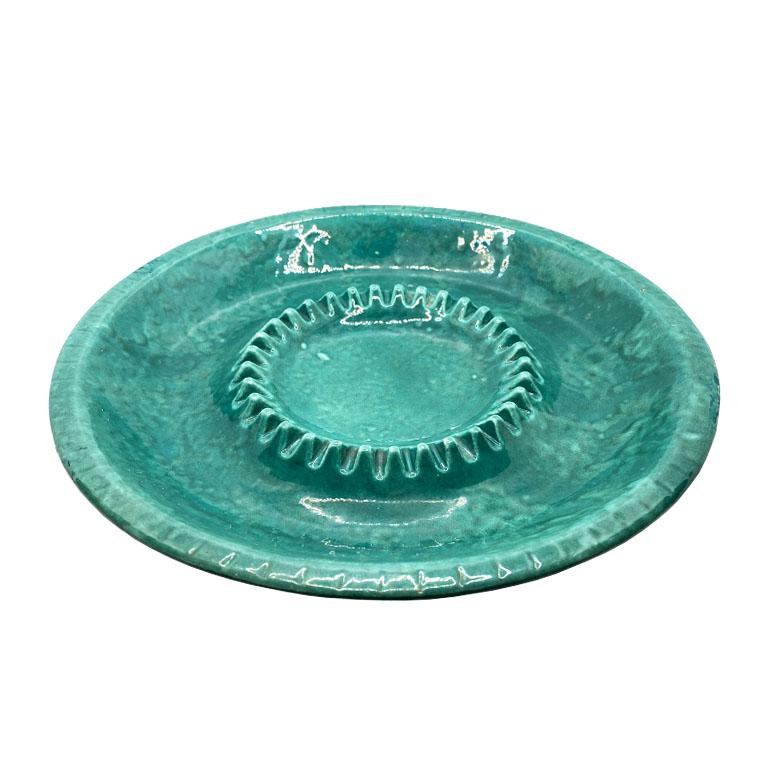 A bright green ceramic ashtray or catchall by Lane & Co. This bright dish will bring a pop of color into any room it finds its home. It is round, and larger than most ashtrays at 11.5