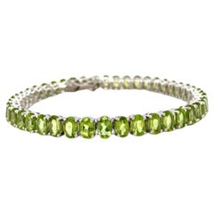 Bracciale da tennis con peridoto verde brillante e montatura in argento Sterling