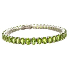 Leuchtend grünes Peridot-Tennisarmband in Sterlingsilber-Fassung