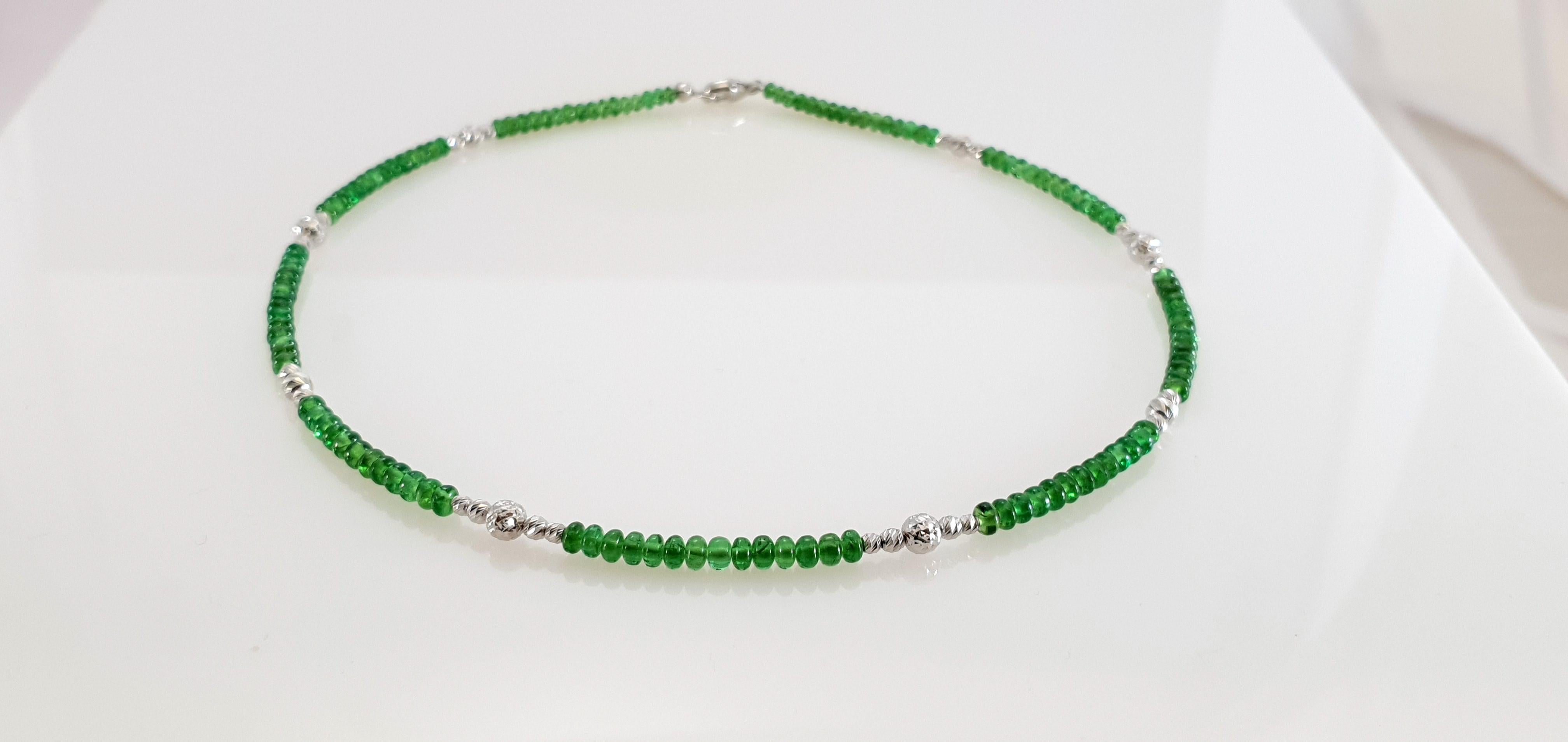This Bright Green Tsavorite Rondel Beaded Necklace with 18 Carat White Gold is handmade. Cutting as well as goldwork are made in German quality. The screw clasp is easy to handle and very secure.
Timeless and classic design combined with bright