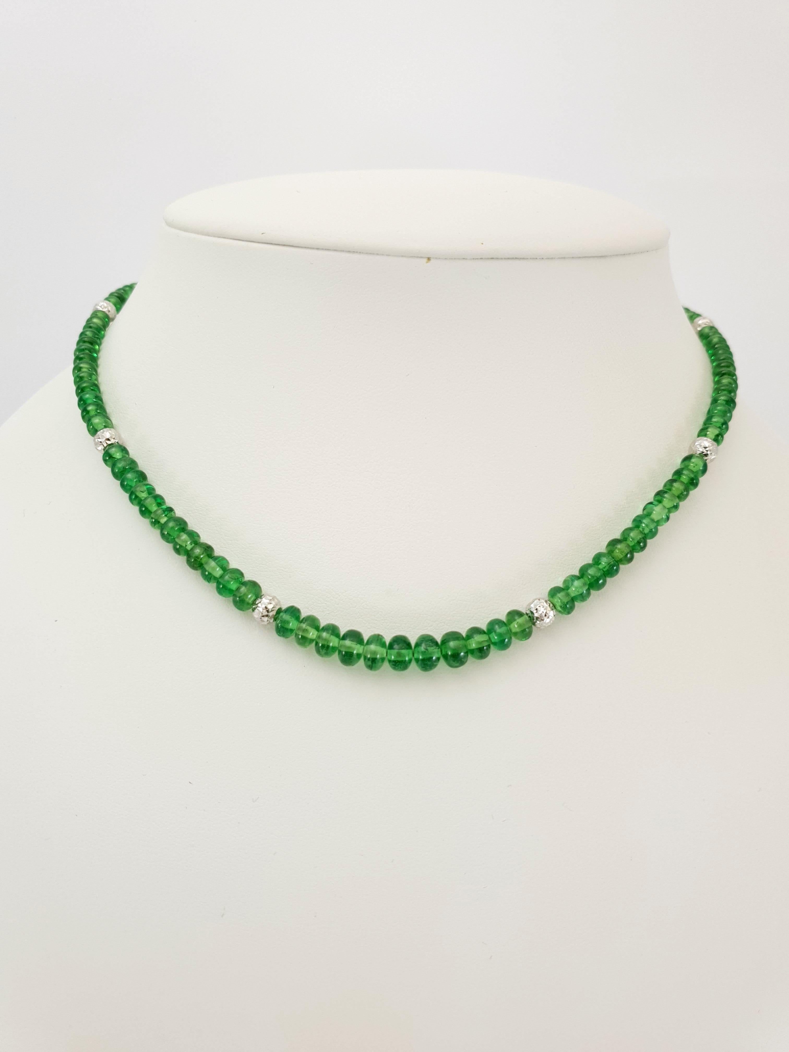 This Natural Bright Green Tsavorite Rondel Beaded Necklace with 18 Carat White Gold is handmade in German quality. The screw clasp is easy to handle and very secure.
Timeless and classic design combined with bright, high translucent Tsavorites and