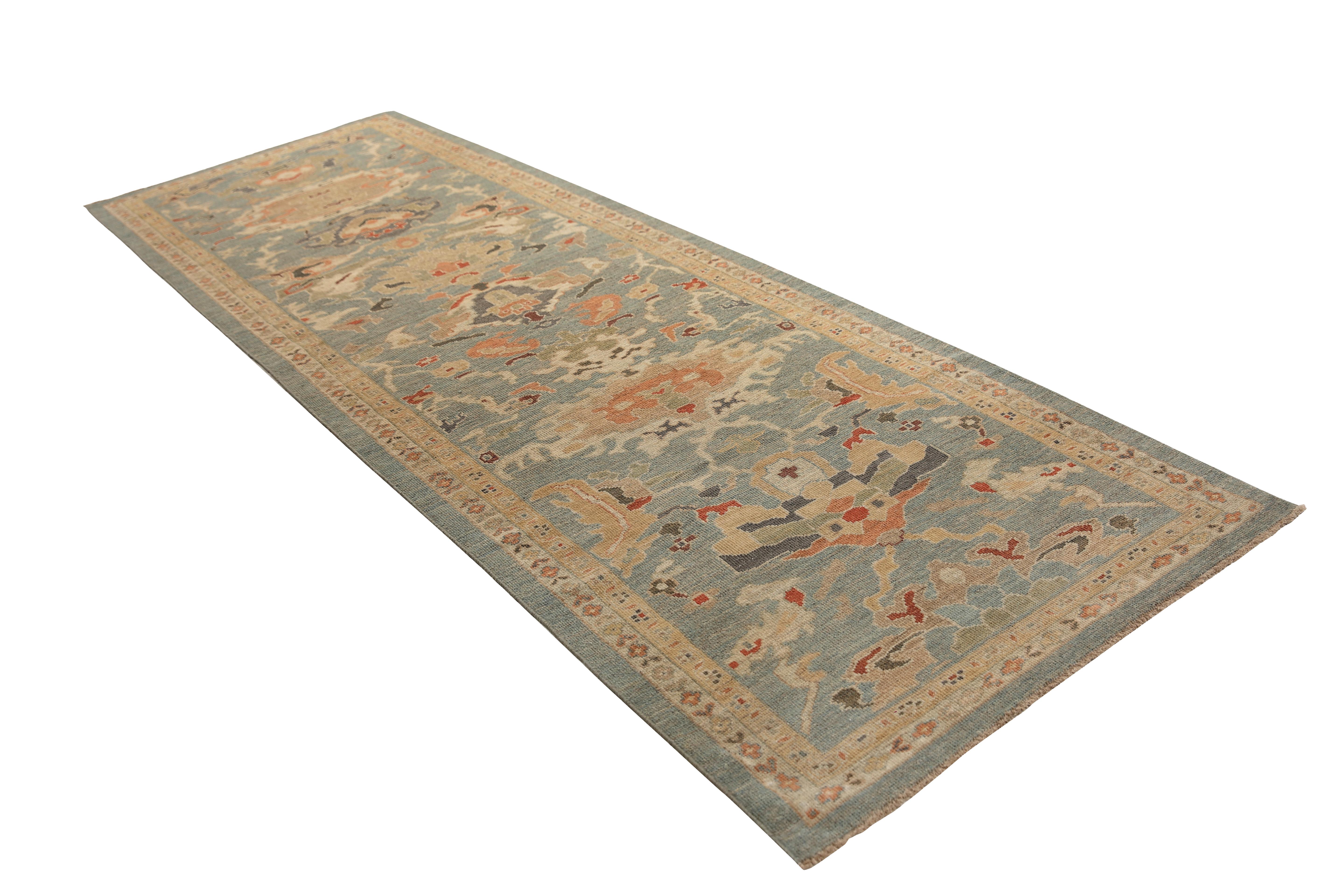 Introducing our stunning handmade Sultanabad runner rug, straight from Turkey! With a beautiful blue/teal background and a distinct border, this rug is sure to impress. The transitional design includes a lovely mix of colors such as blue, orange,