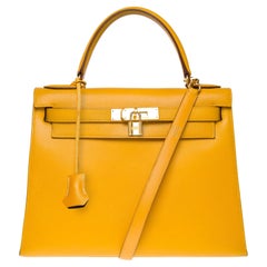 Bright Hermès Kelly 28 sellier handbag strap in Courchevel Yellow leather, GHW