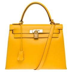Bright Hermès Kelly 28 sellier handbag strap in Courchevel Yellow leather, GHW