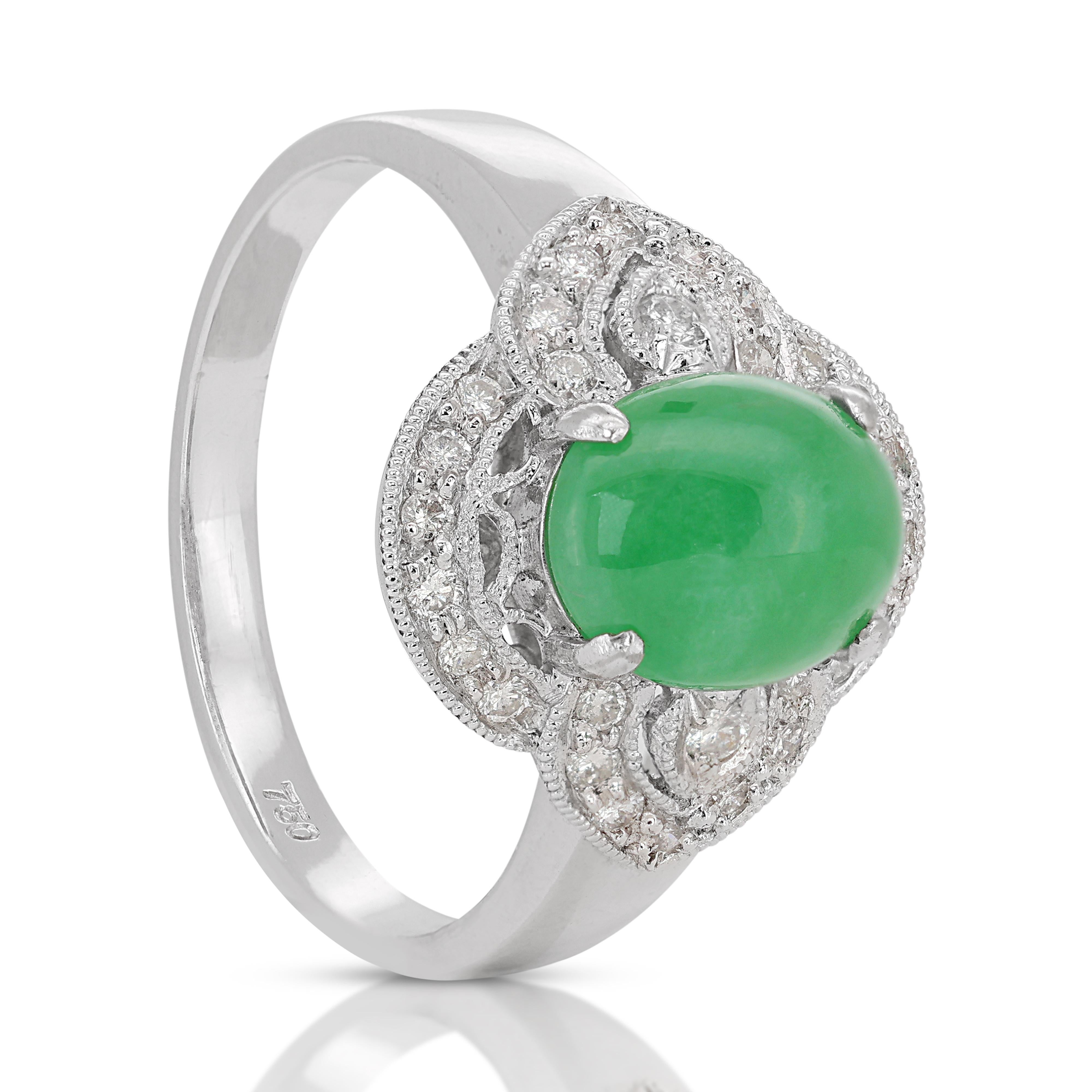 Introducing our stunning 18K White Gold Jade Ring, a true statement of sophistication and elegance. At its center lies a captivating cabochon-cut jade stone, boasting a substantial carat weight of 1.96ct. The rich green hue of the jade exudes a