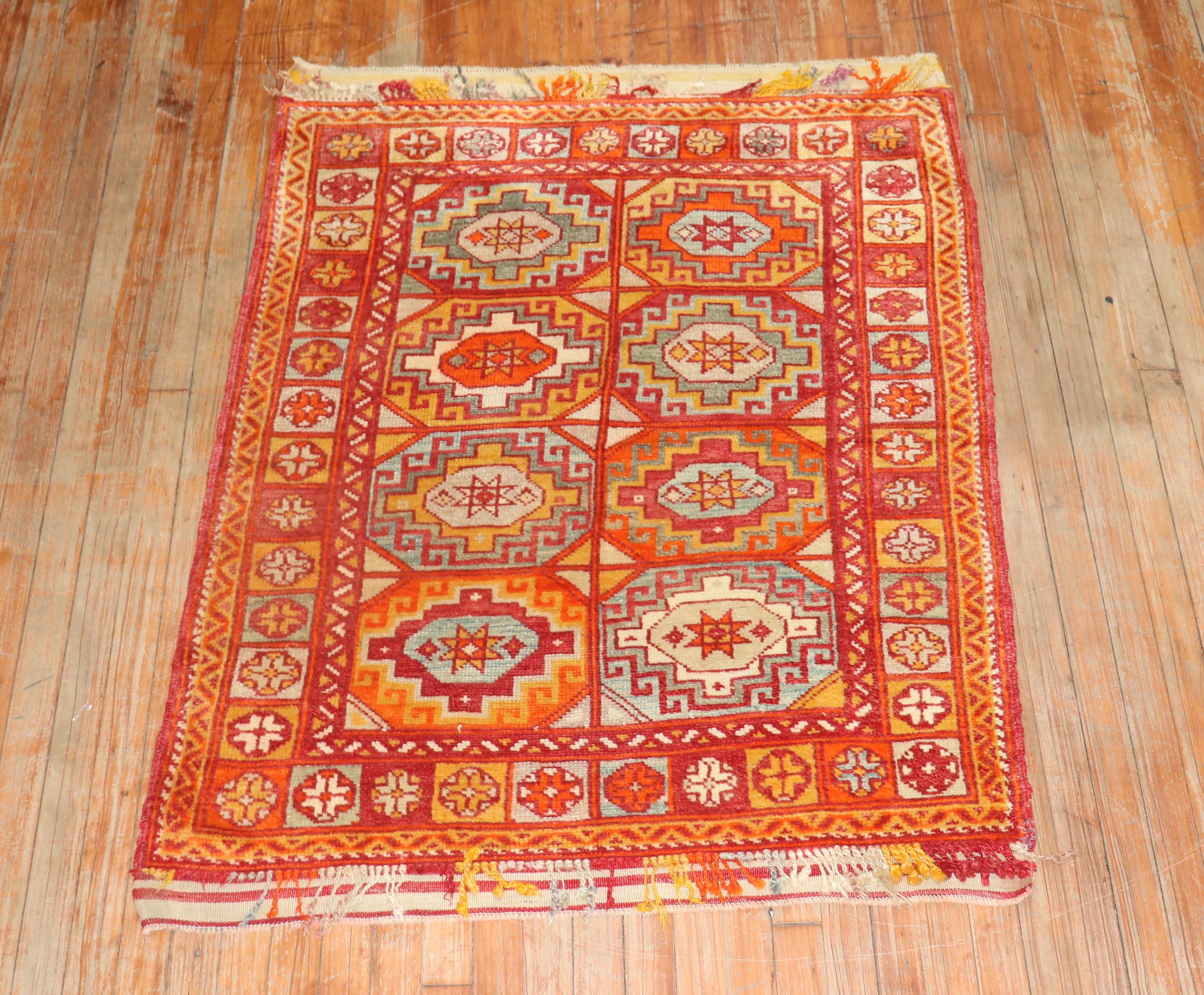 Bright colors highlight this early 20th century Turkish Bergama rug

Measures: 3'6” x 4'4”.