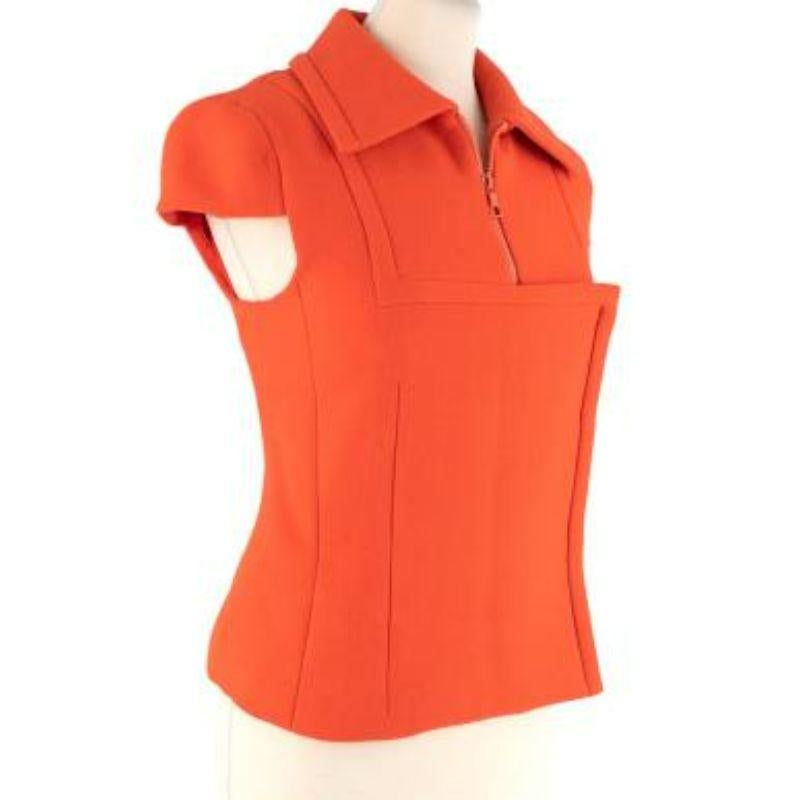 Prada bright orange wool short sleeve zip top
 
 
 
 -Zip fastening upper part & snap button fastening bottom part 
 
 -Wide collar 
 
 -Fully lined 
 
 -Cap sleeves 
 
 -Structured fitted body 
 
 
 
 Material: 
 
 
 
 100% Wool 
 
 
 
 Condition