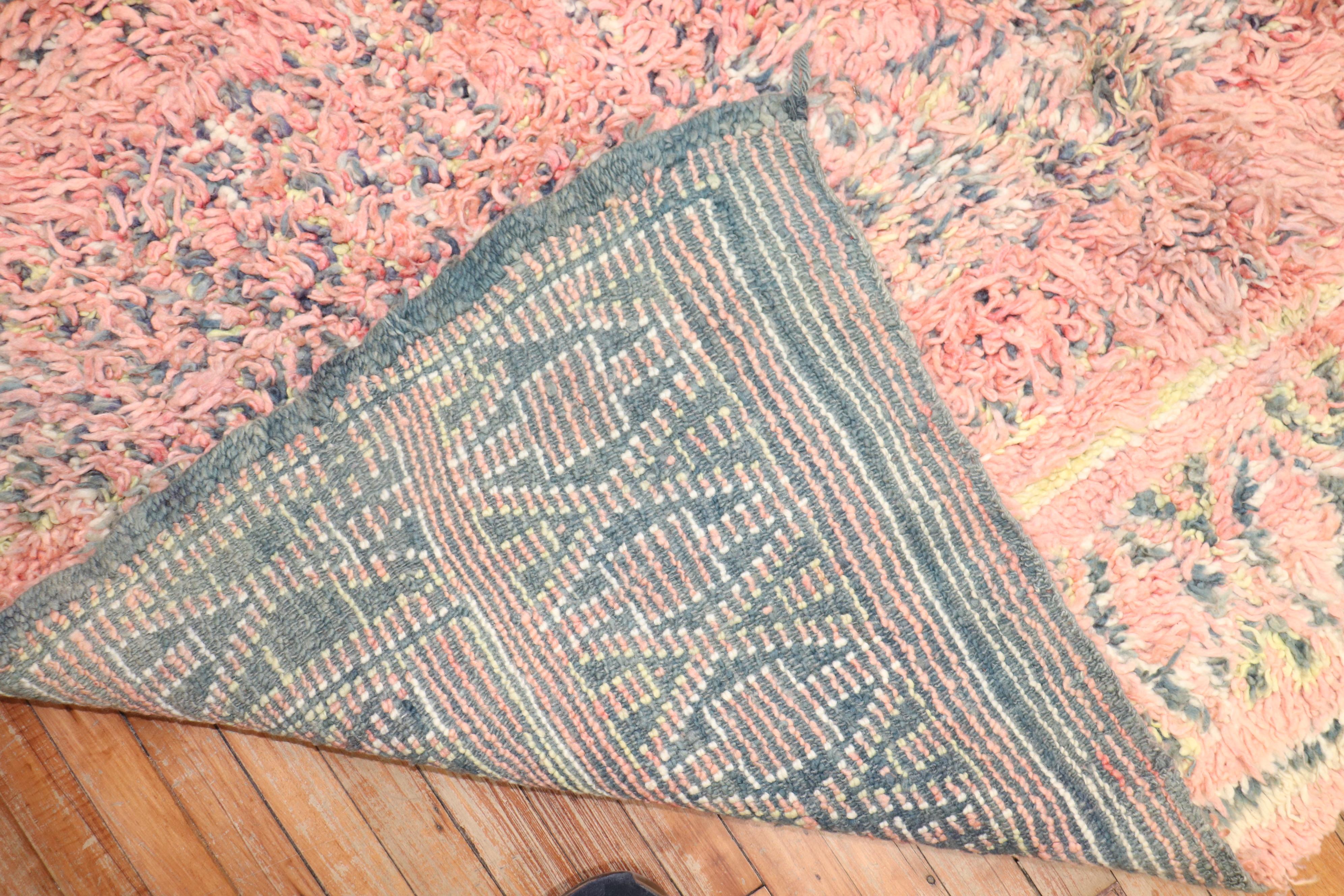 A 3rd quarter of the century One of a kind Moroccan Rug in bright pink and yellow.
Bohemian at its finest!

Size: 6'6'' x 9'1
