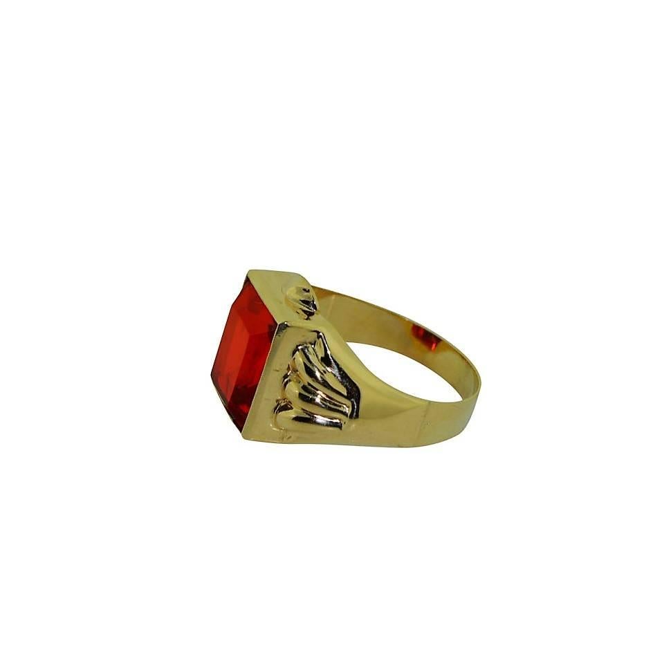 Vintage 10Kt Solid Yellow Gold Art Deco Ring set with a bright red stone. Size 9.5. This ring is New Old Stock, Unworn. A classic Men's ring of the period, weighs 4.3grams.

Nearly 25 years ago I purchased a collection of rings from an old jeweler