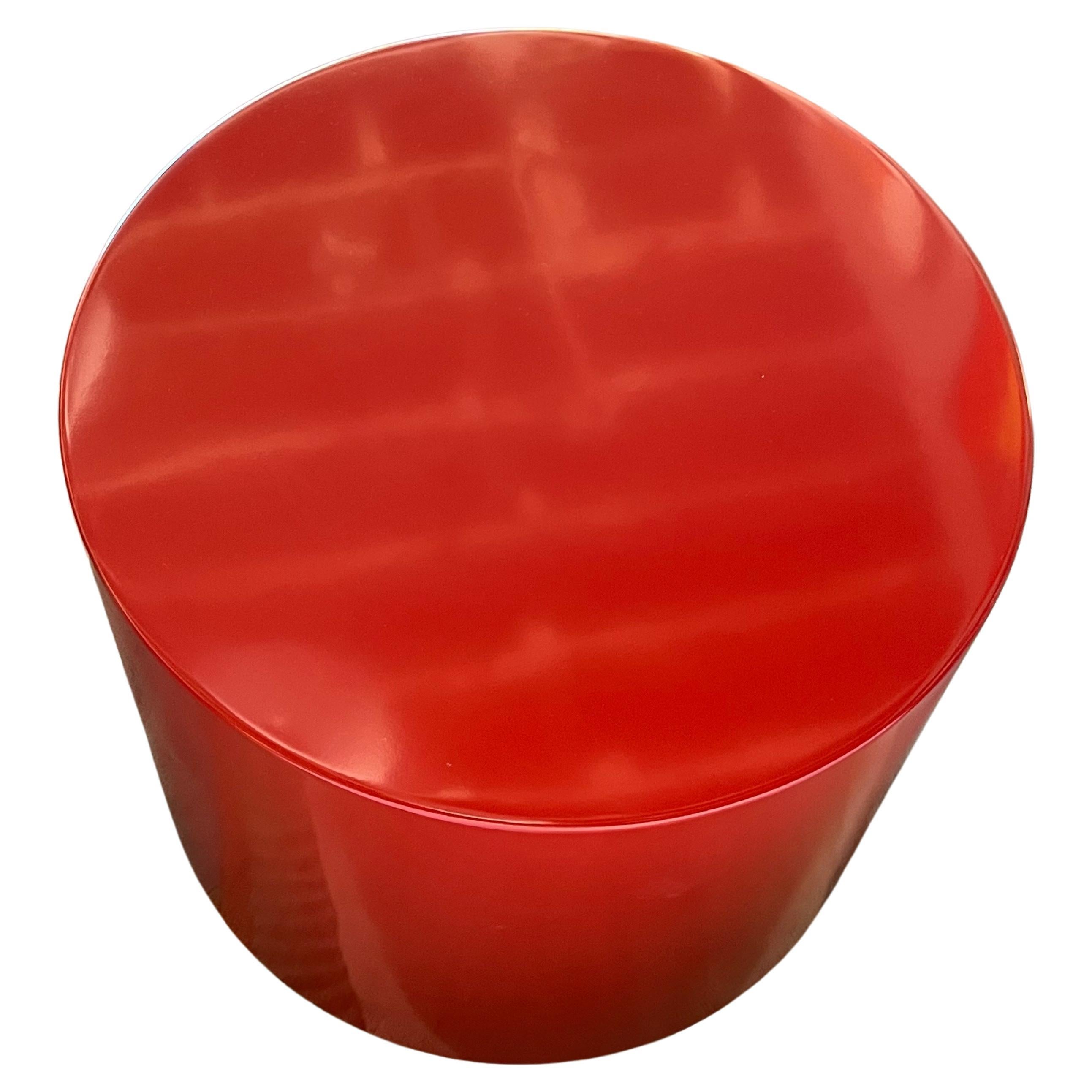 This pedestal is lacquered in a bright crimson red.
It is mounted on a swivel base and can be a very convenient cocktail table or a pedestal for a large sculpture.