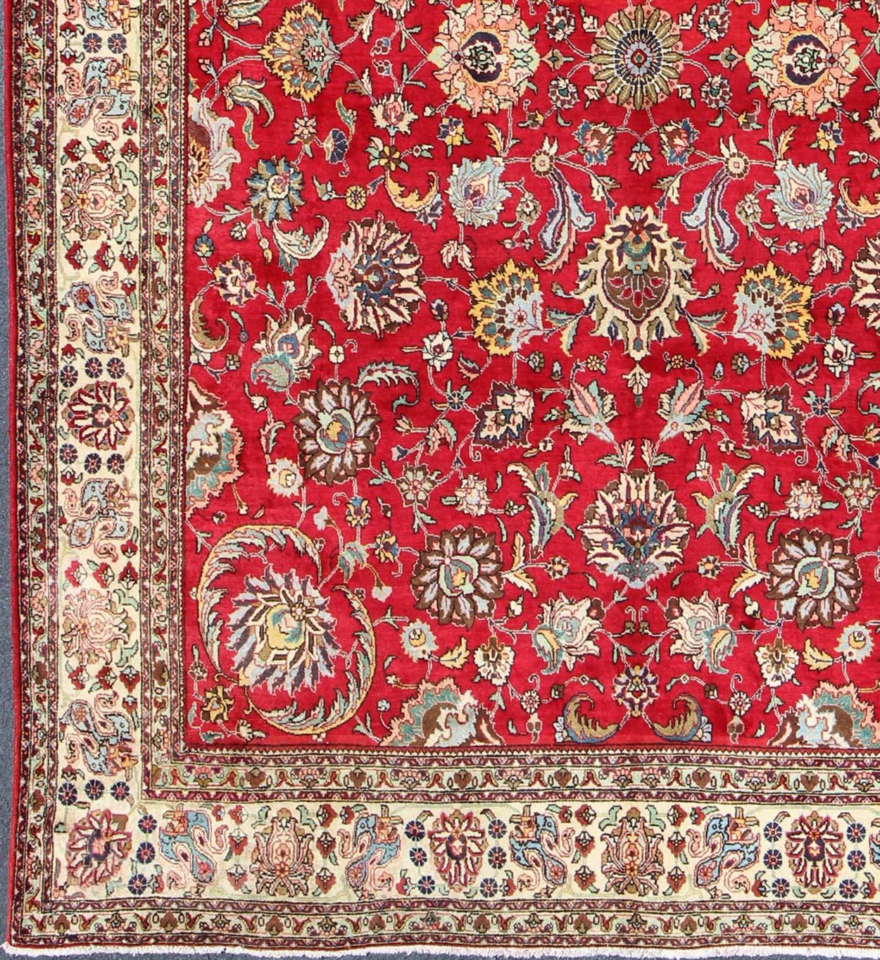 Semi Antique Persian Tabriz Rug with All-Over Blossom Design In Red and Ivory. Keivan Woven Arts / rug H-411-83, country of origin / type: Iran / Tabriz, circa 1960
Measures: 9'6 x 13'1.  
This Semi Antique Persian Tabriz carpet (circa mid-20th