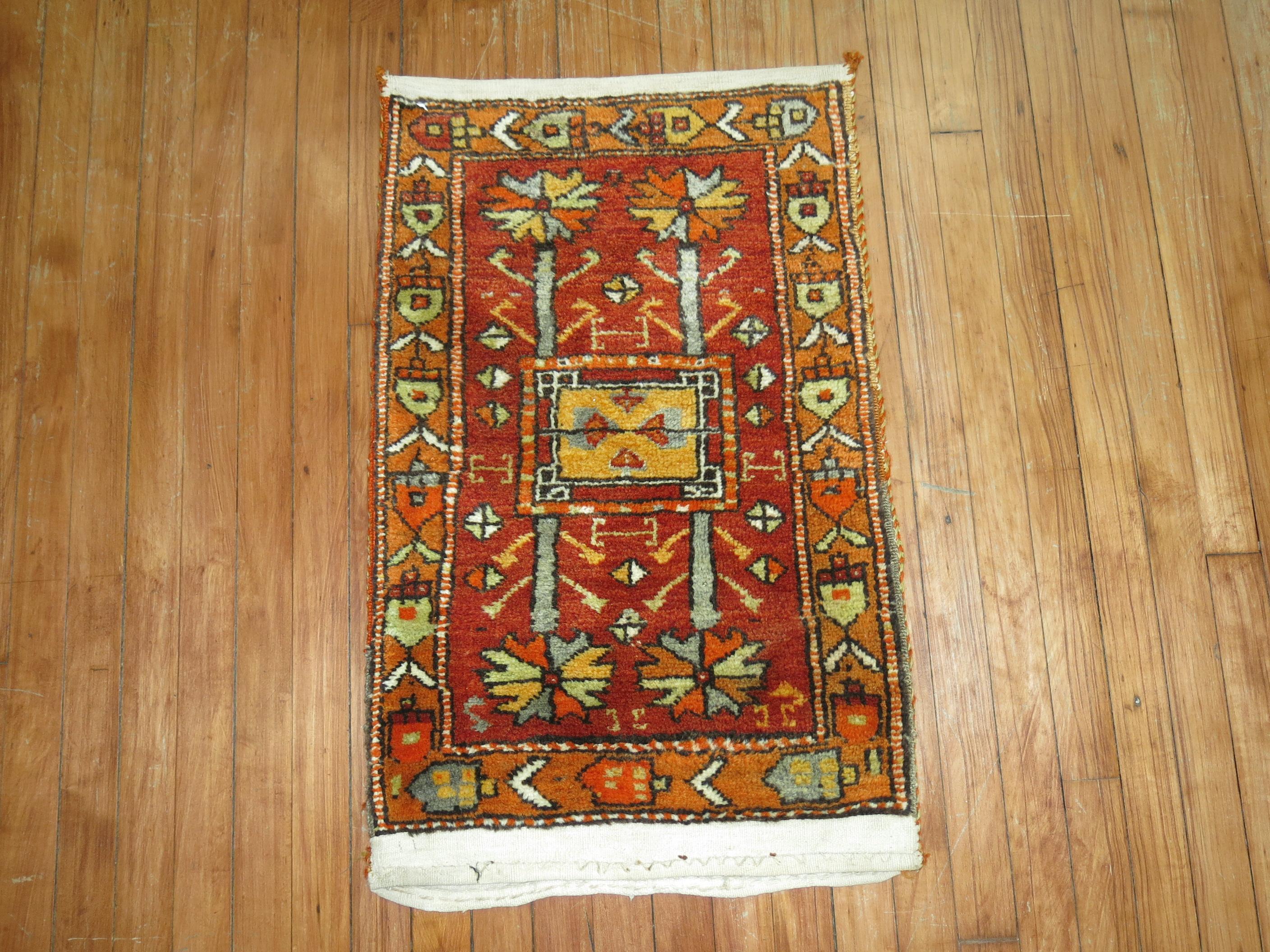 Bright Turkish Anatolian rug in vivid reds and orange accents

Measures: 1'9