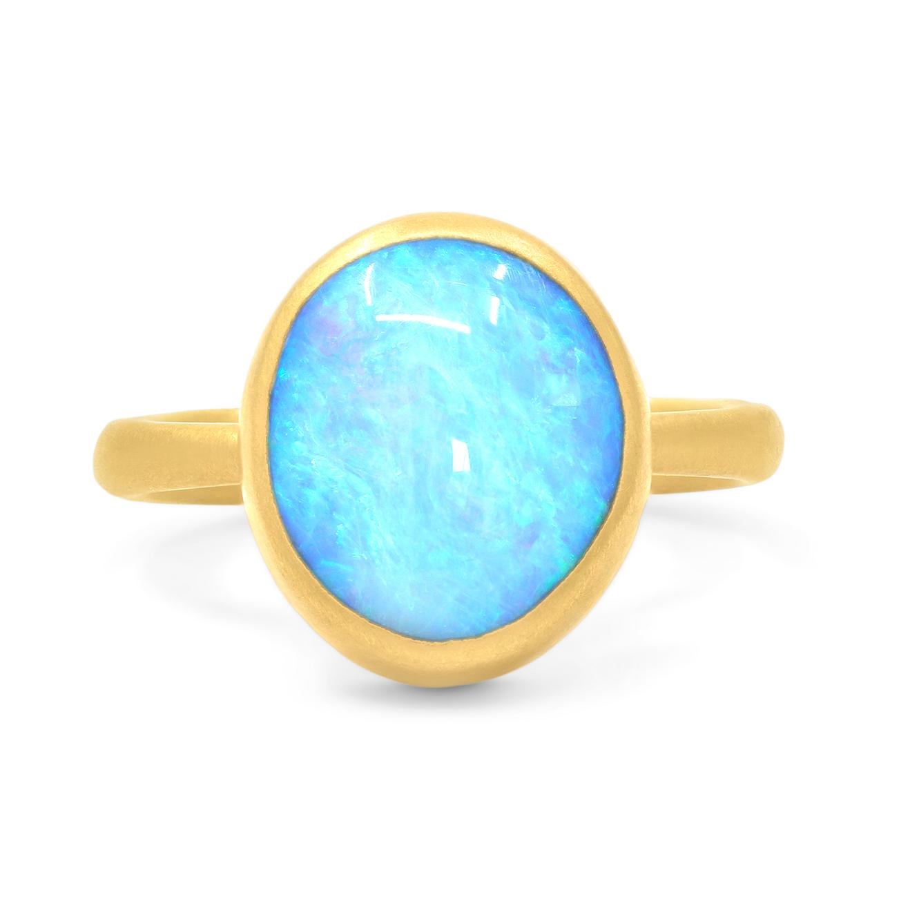 One of a Kind Ring by acclaimed jewelry maker Lola Brooks hand-fabricated in signature-finished 22k yellow gold featuring a magnificent 5.82 carat bright violet blue boulder opal cabochon with primary neon green, violet, and blue fire, bezel-set and