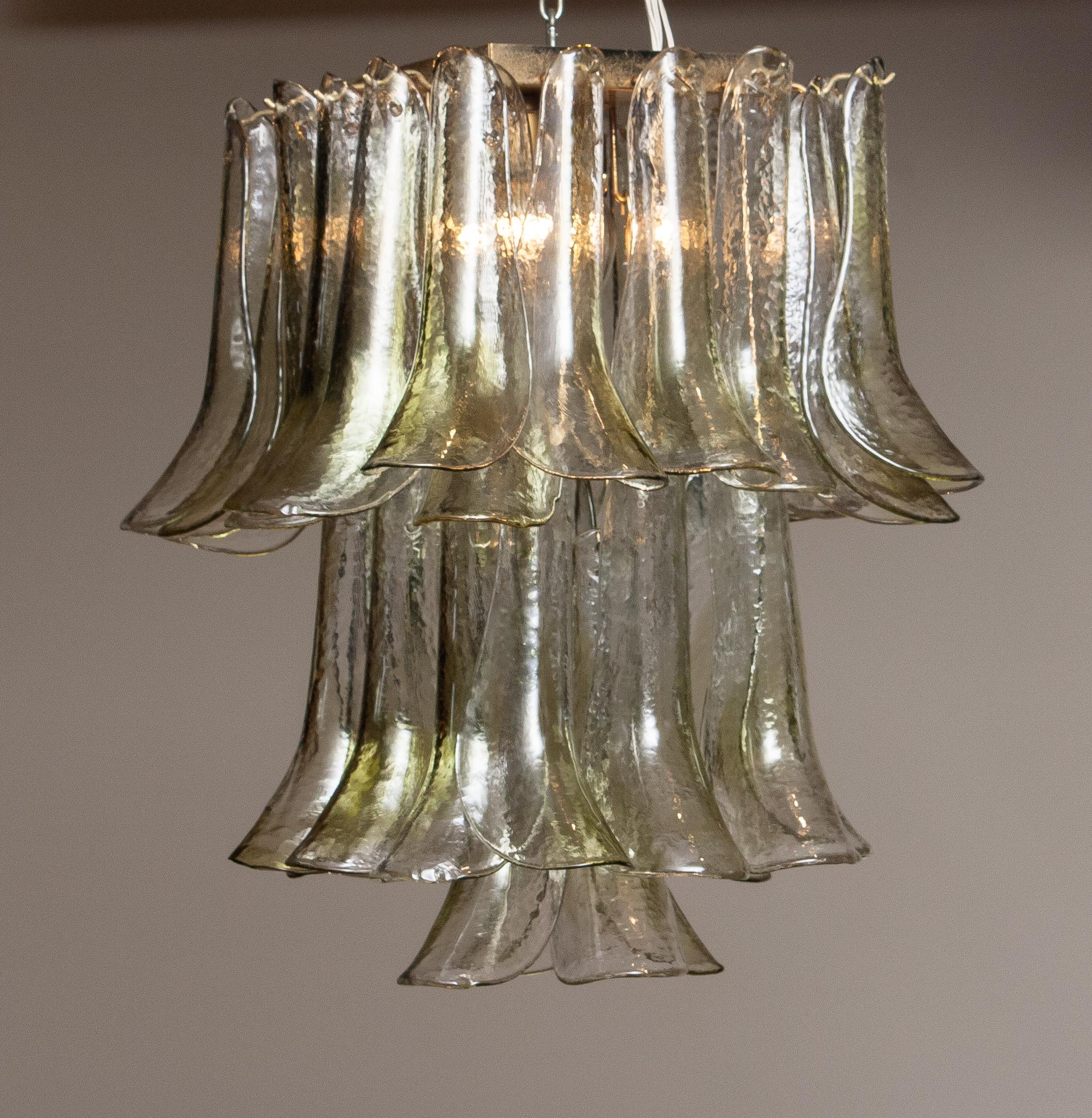 Beautiful square flush mount filled with bright with green tones art glass shades 'Selle' made by 'La Murrina' Murano Italy in the end of the 1970s. Consist four E14 / E17 screw bulbs and suits 230 volts as well as 110 volts. Technically 100%.
Every