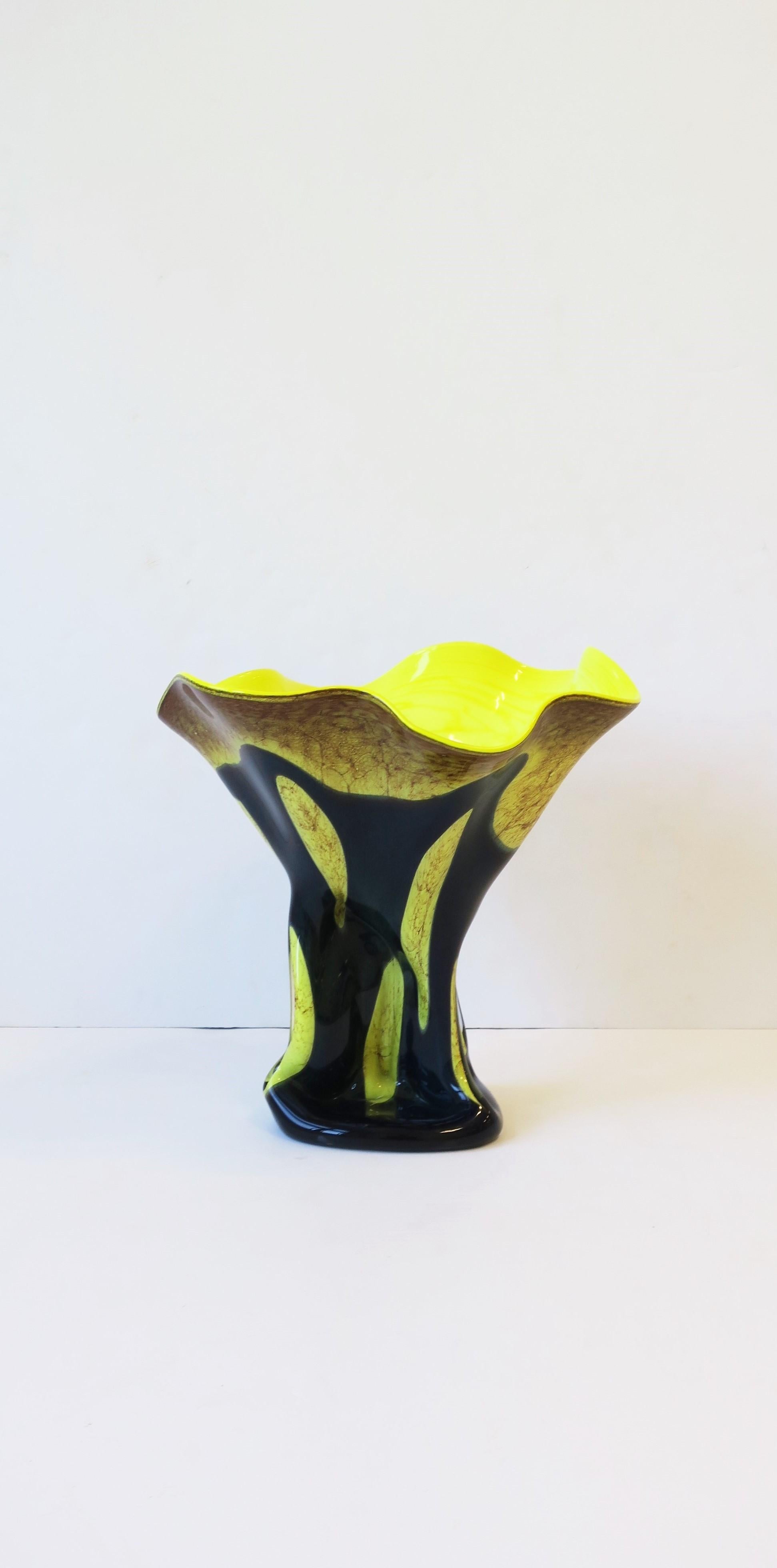 A very beautiful organic modern hand-blown bright neon yellow and dark teal blue studio art glass sculpture vase, circa mid to late-20th century. Beautiful as a standalone piece or with flowers, branches, etc. Polished pontil mark on underside as
