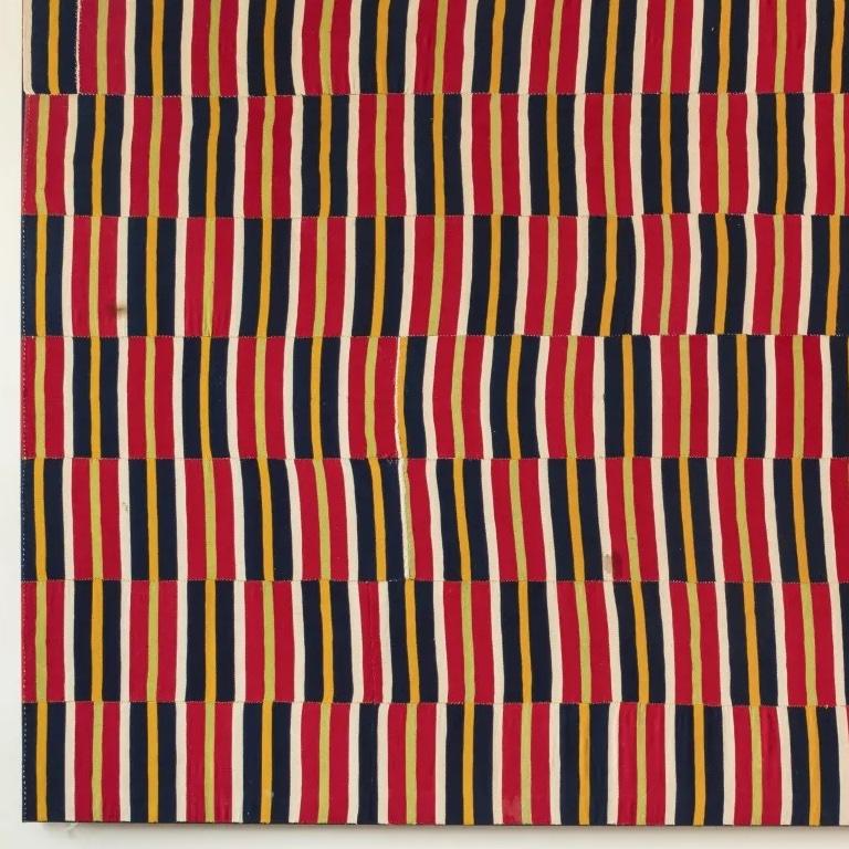 An early and rare weft faced Ewe cloth woven in strops of brightly coloured red, blue, yellow cream, lime green and ivory. 
A great example, large size. Conservation mounted on a stretcher.
Ghana c. 1900
Measures: H123 W225.
