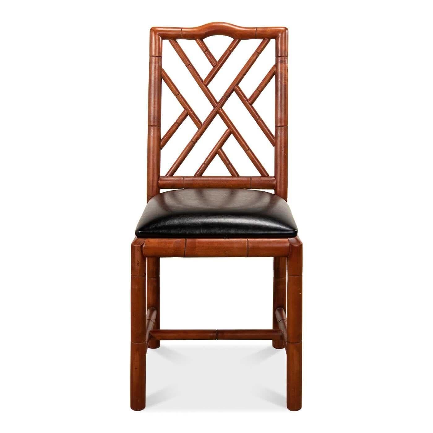 Brighton Faux Bamboo side chair. This hand-carved chair with a faux bamboo motif is inspired by pieces made for George IV, the Prince Regent, in the 1920s. It is shown in our antique teak finish with a faux leather seat. 

Dimensions: 17