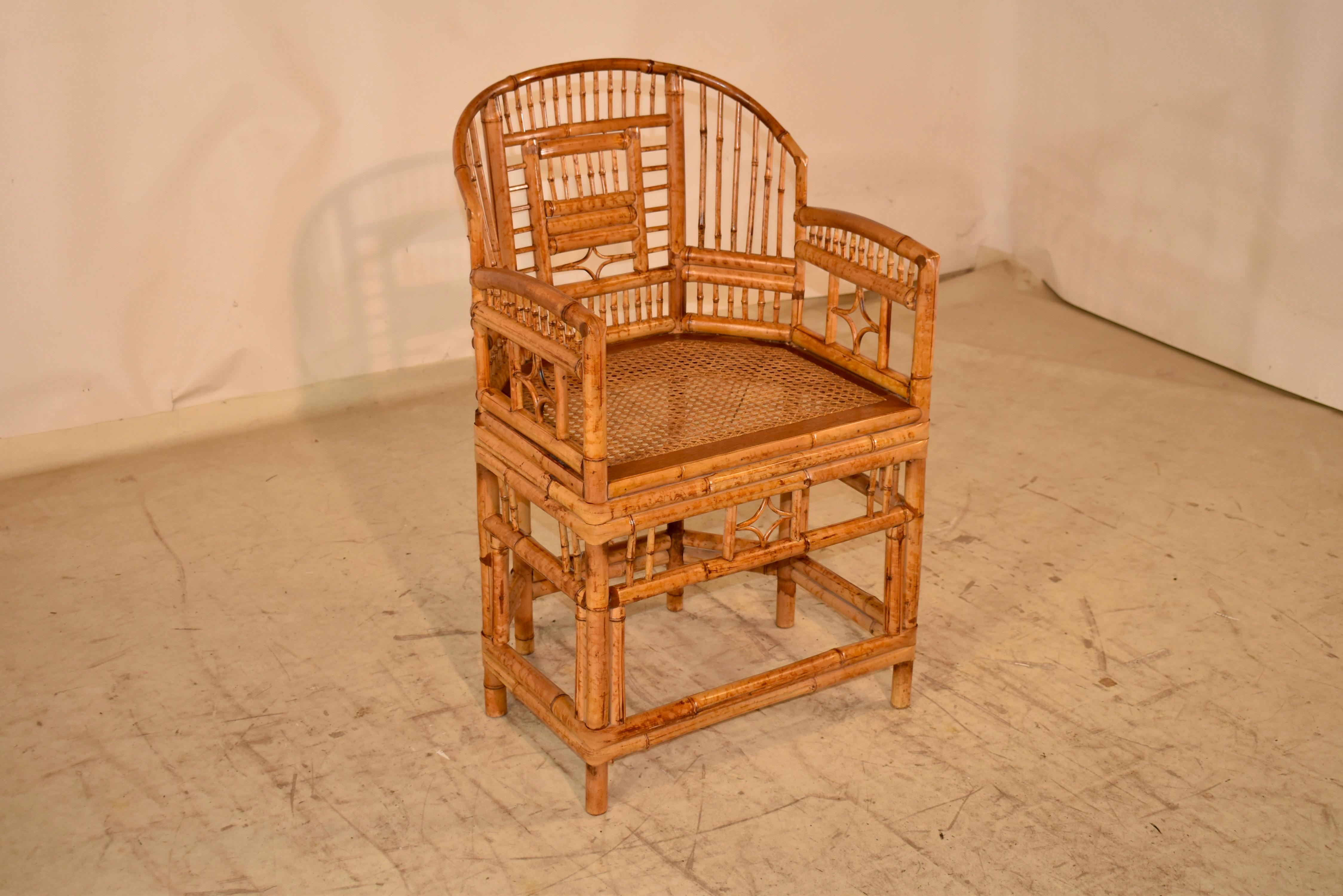 Circa 1960's Brighton Pavilion barrel chair from England.  The intricately patterned back and sides of the barrel chair are extraordinary and detailed, for an updated elegance.  The seat measures 19 inches in height and is caned.  This chair would