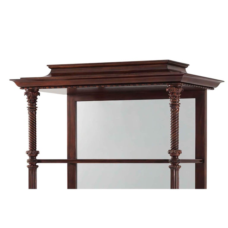 Inspired by the Regency style from the Brighton Pavilion, the four-tier Neo Classic étagère is rife with broader global influences. Like the molded pagoda cornice or the spiral column supports detailed with Classic carved capitals and set on lobed