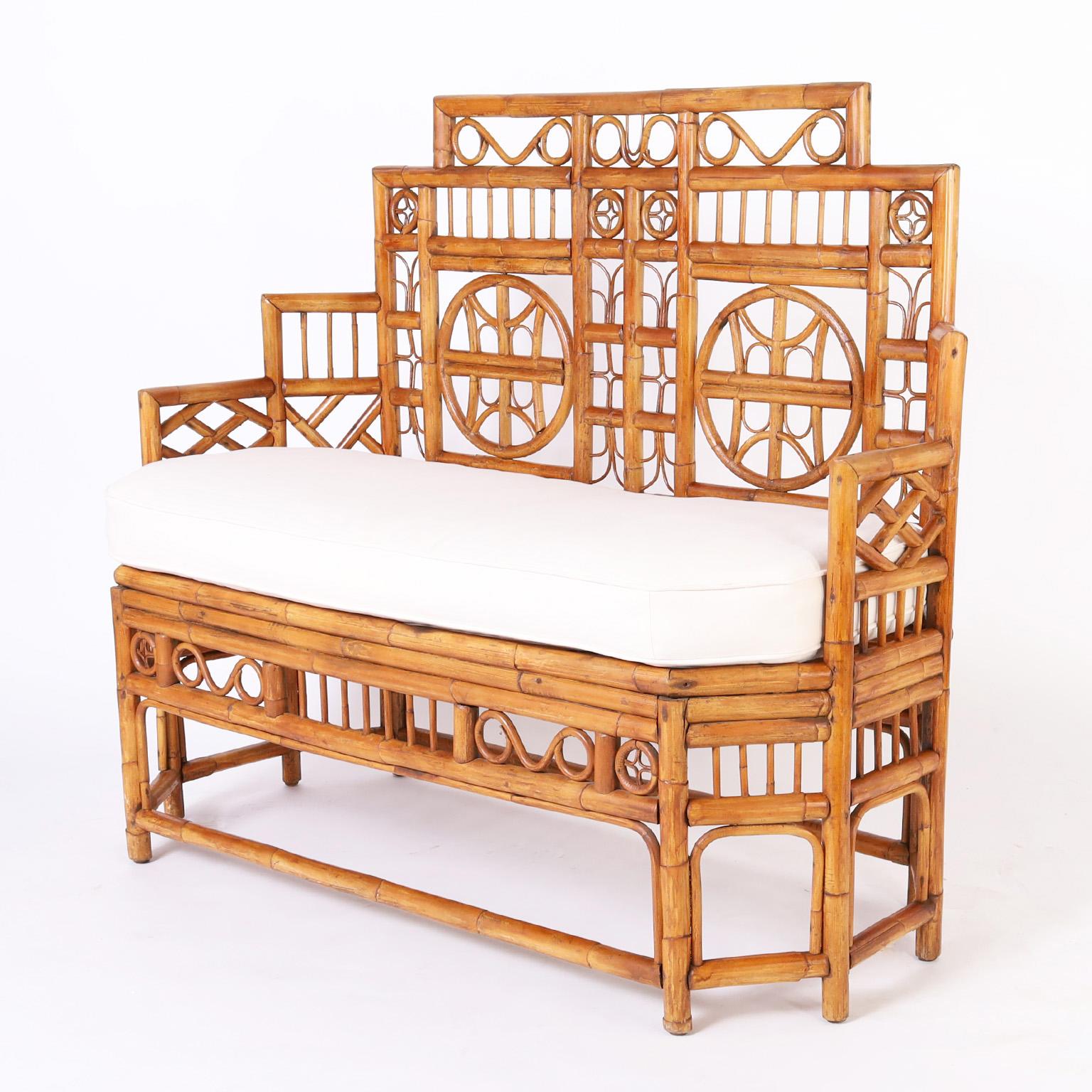 Rare and remarkable British colonial settee or bench crafted with bamboo and bent bamboo in the iconic Chinese Chippendale style of the Brighton Pavilion.