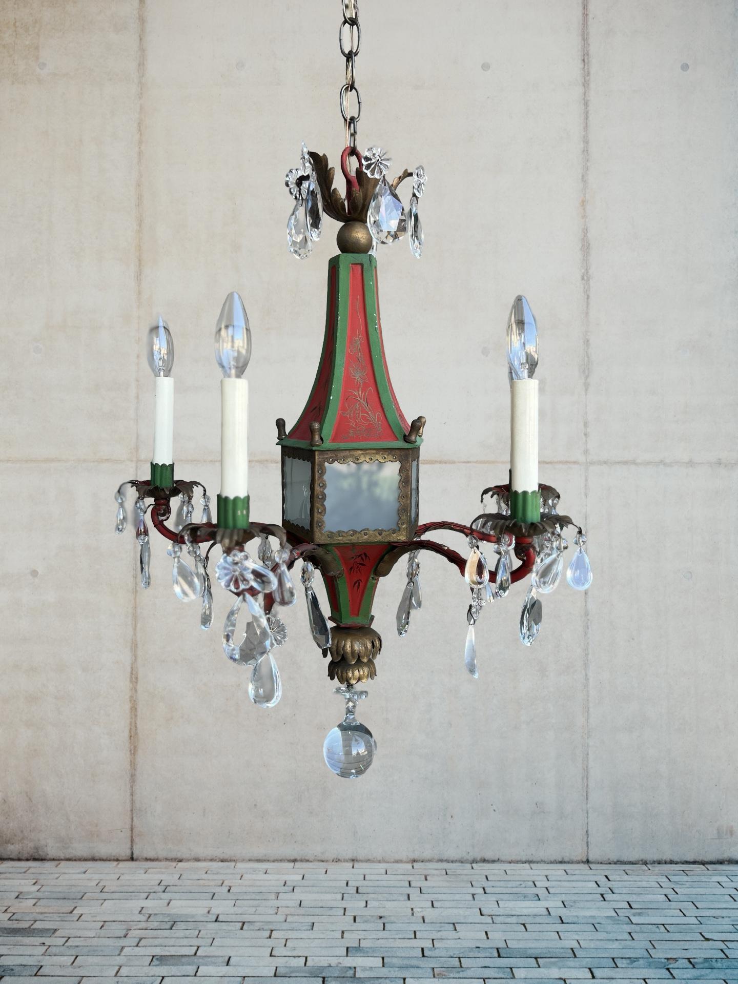 Attributed to E. F. Caldwell Founded in 1895 by Edward F. Caldwell (1851–1914) and Victor F. von Lossberg (1853–1942). 

A Regency Brighton Pavilion style 5-Light chandelier with a chinoiserie (red & green) painted tin body, scrolled iron arms