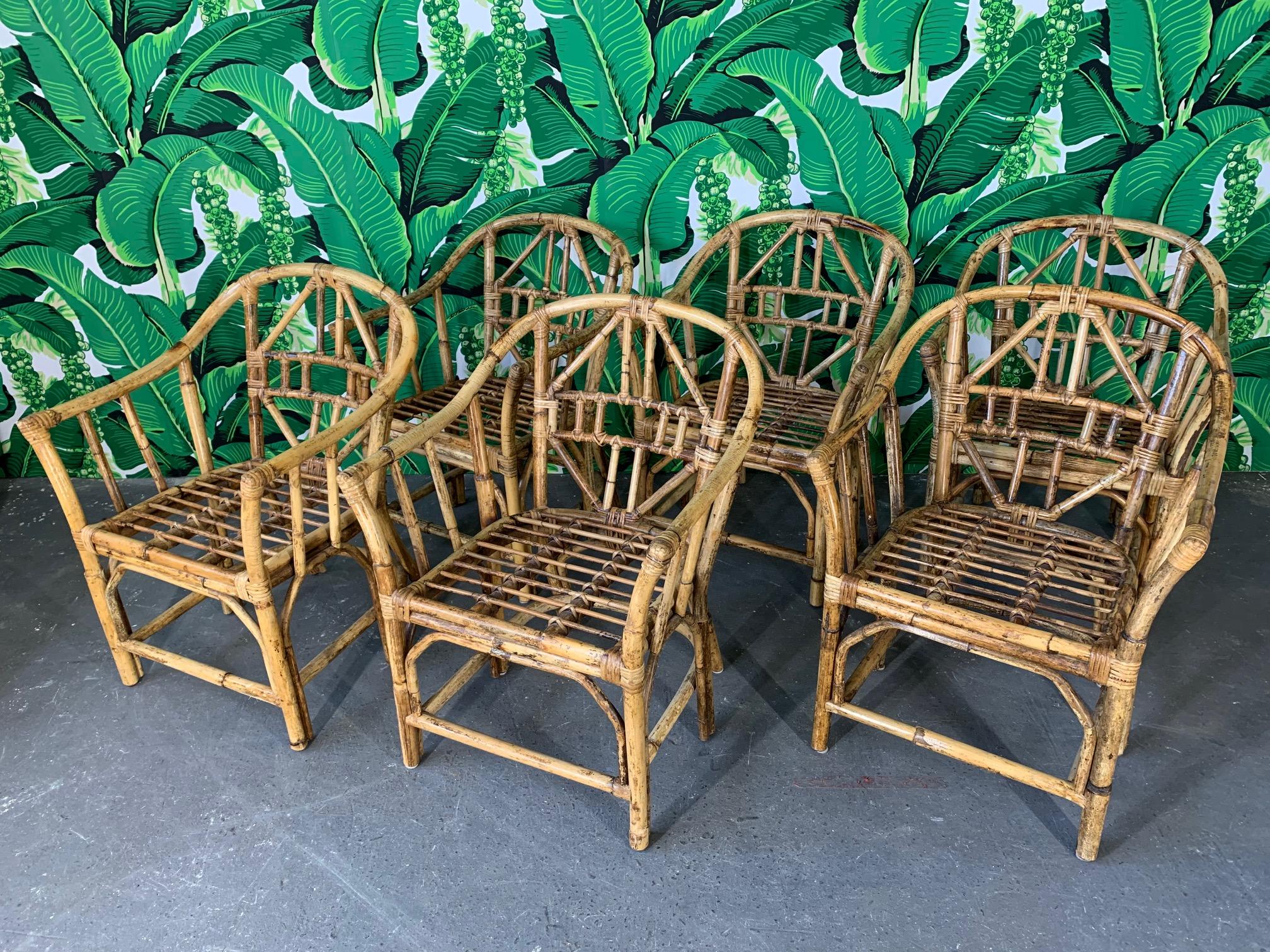 Set of 6 Brighton style rattan arm chairs. Bamboo construction with geometric design. Very good vintage condition with minor imperfections consistent with age.