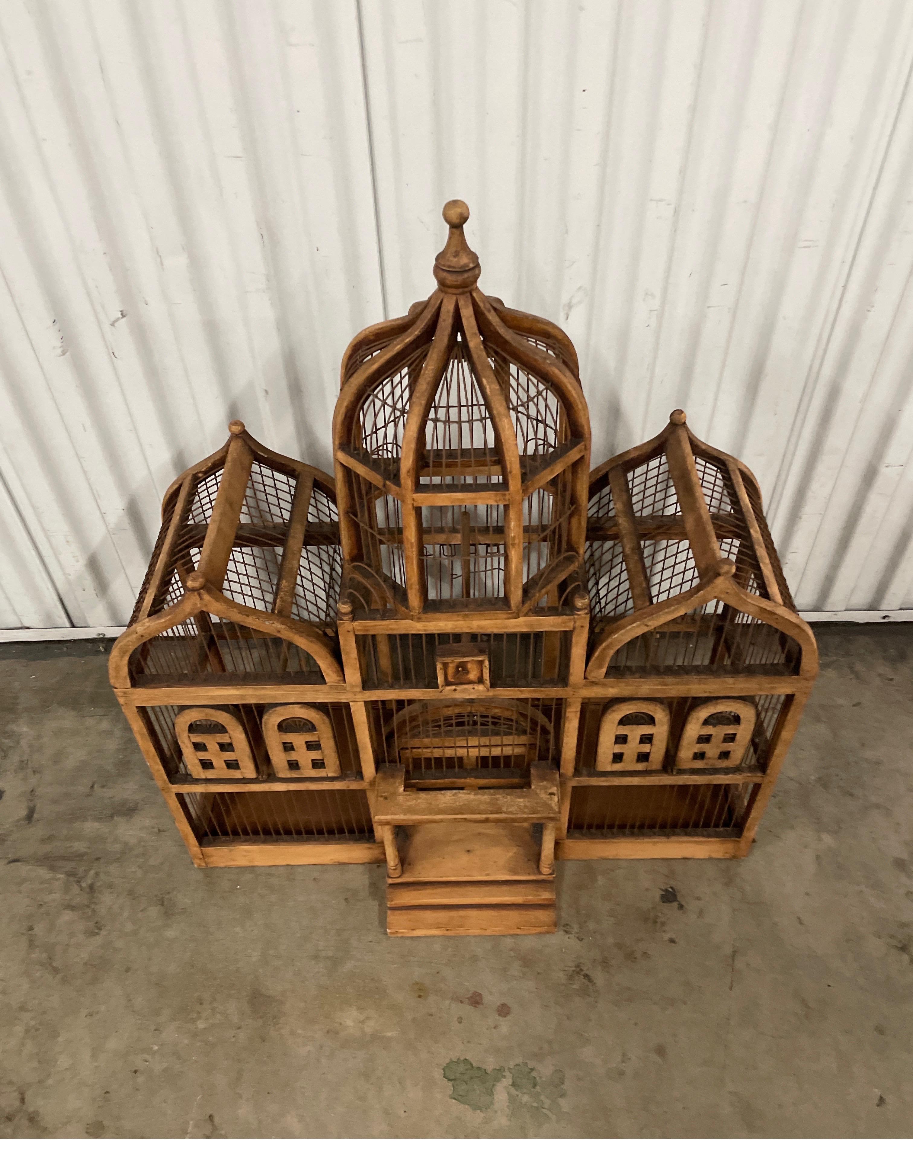 Large Brighton Pavillion wood bird cage. This is a functional bird cage made with great architectural details.  