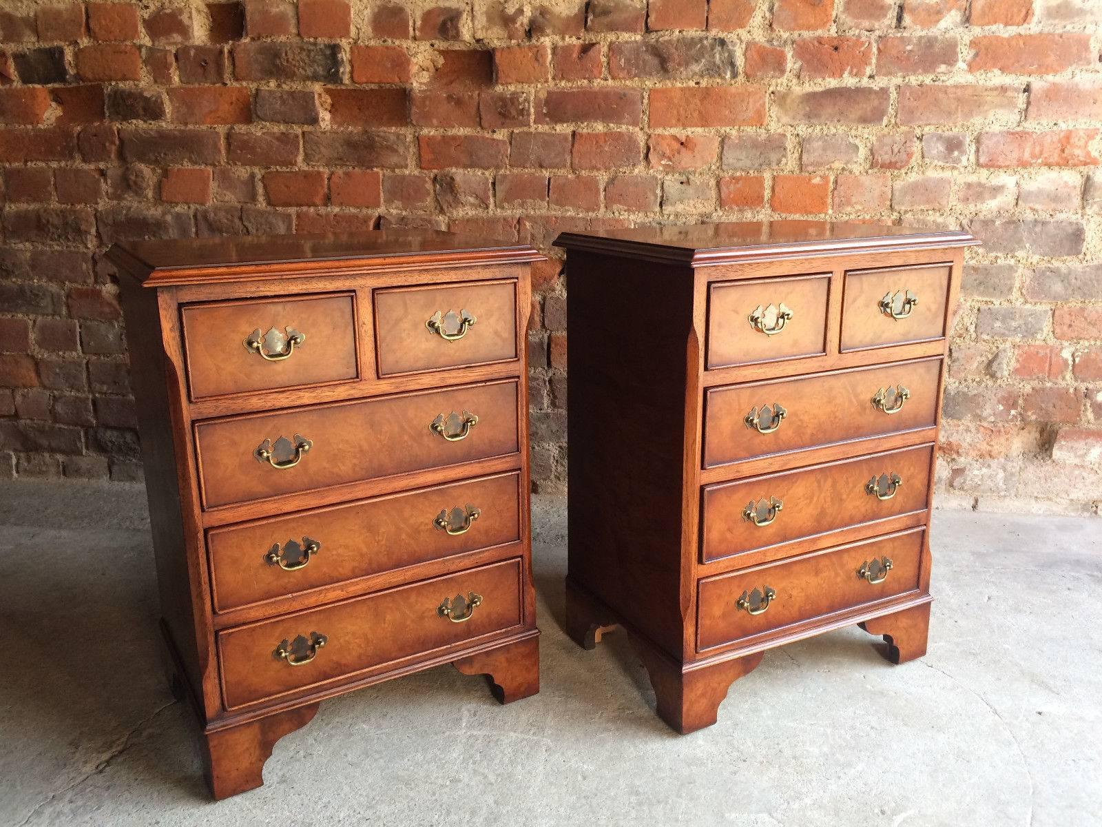 A wonderful pair of late 20th century George III style walnut bedside chests by Brights of Nettlebed, fitted with two short and three long drawers, raised on bracket feet, the chests would enhance any bedroom or living room used as side or light