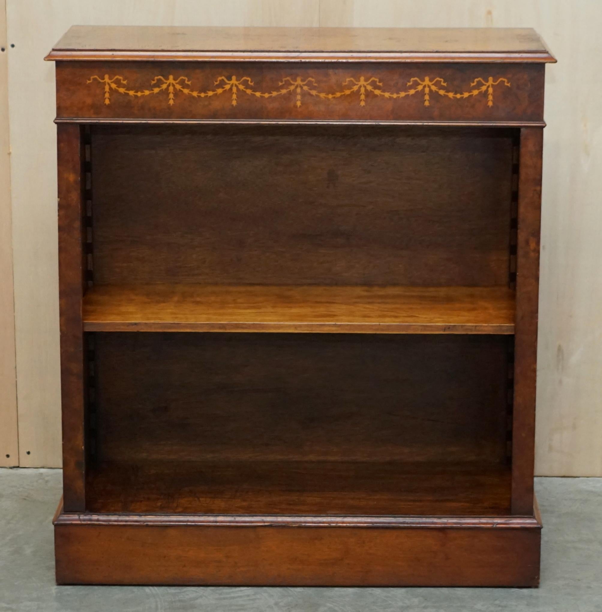 We are delighted to offer for this lovely Brights of Nettlebed Burr Elm, Walnut inlaid, Sheraton Revival style dwarf open library bookcase

A very good looking well made and decorative piece, the shelf is height adjustable and or removable so it