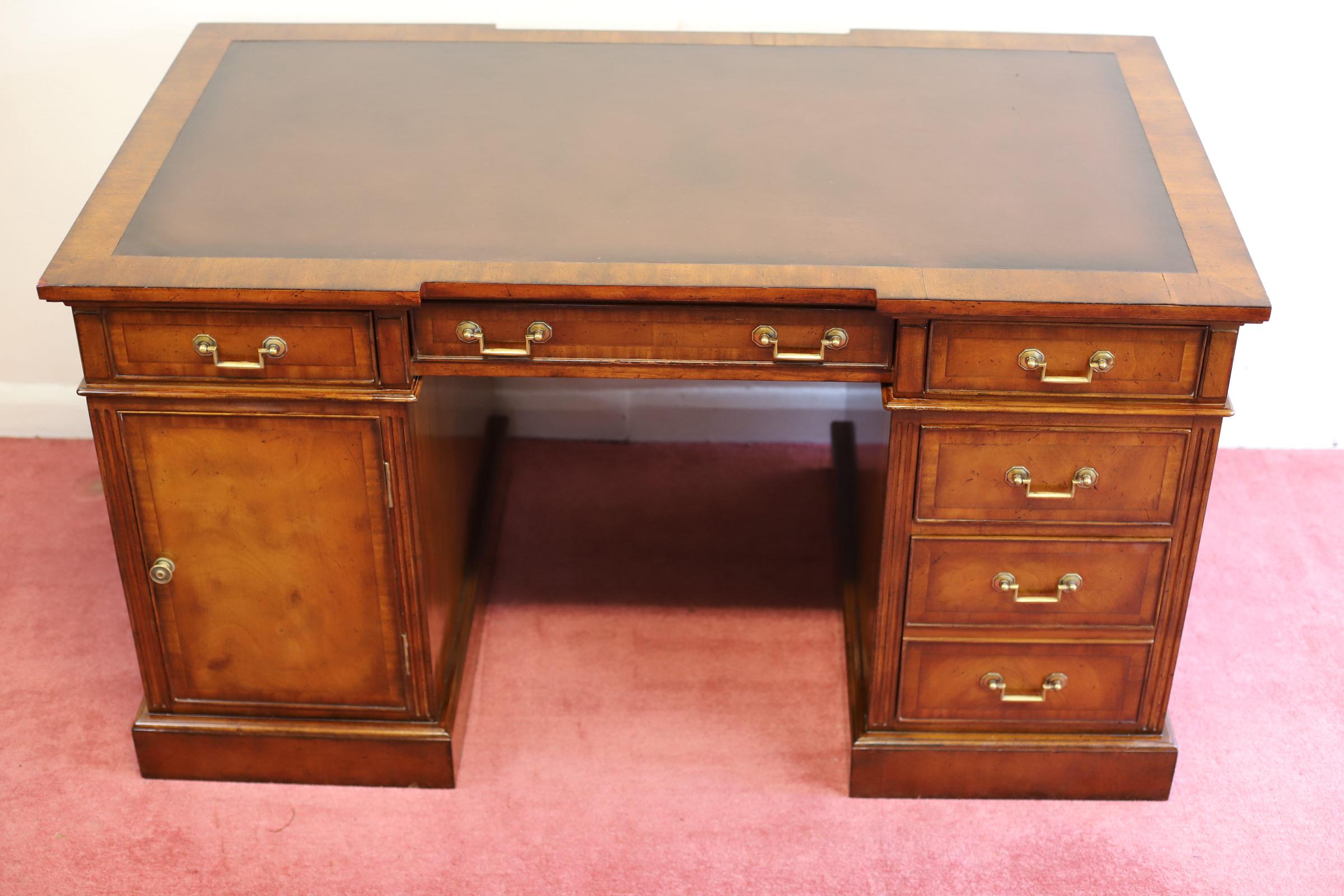 We delight to offer for sale this beautiful and well made partners desk , it is double side , the front has eight drawers , the double side sims to have the same formation however the top drawers are dummy’s and the pedestal drawers had joined