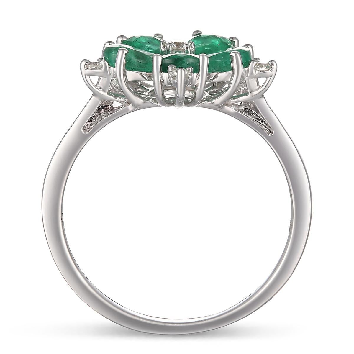 Brilliant 14 Karat White Gold,  Diamond, And Emerald Flower Ring.

Diamonds of approximately 0.13 carats and Emerald approximately 1.31 carats, mounted on 14 karats white gold ring. The ring weighs approximately 2.53 grams.

Please note: The charges