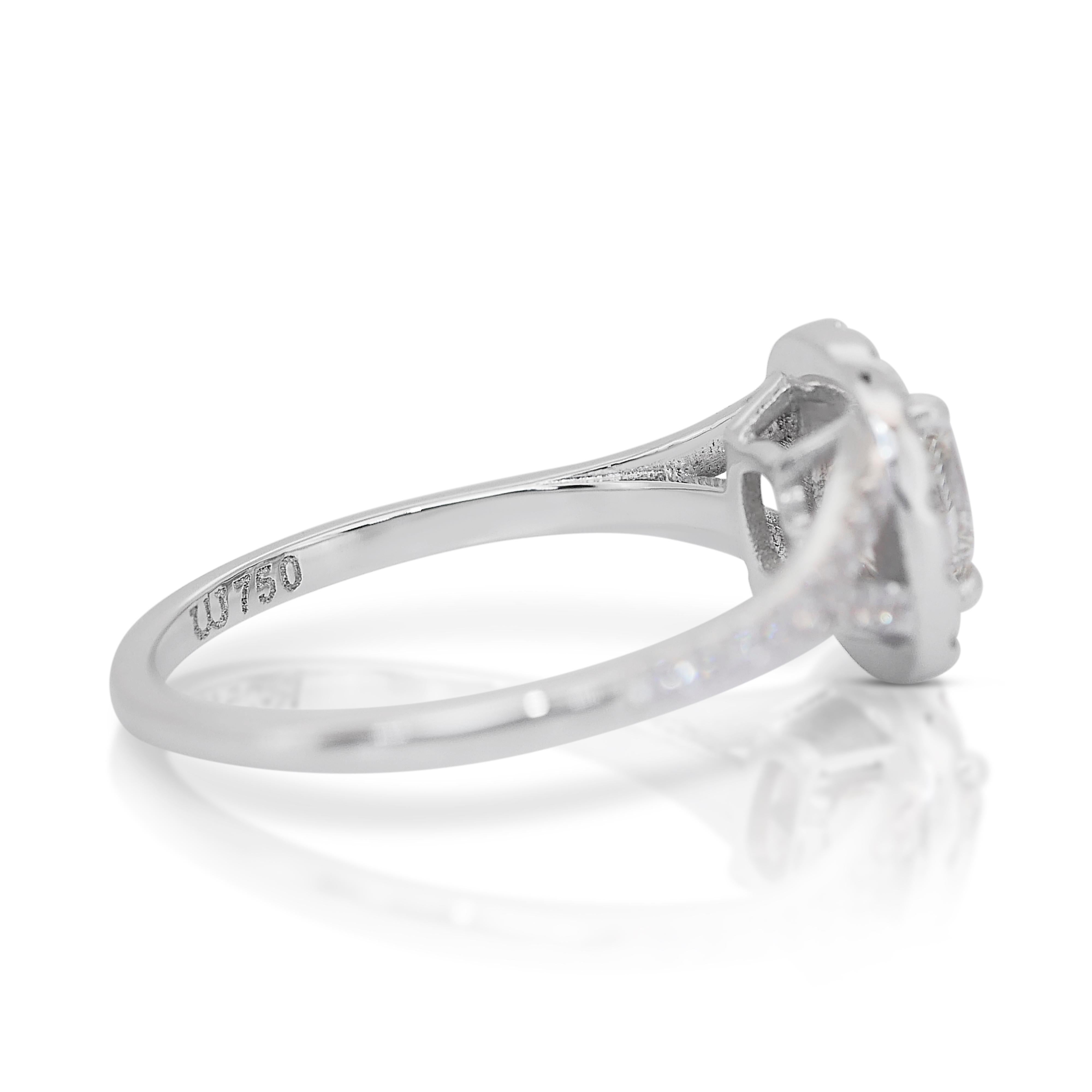 Brillant 1,45ct Diamant Halo Ring in 18k Weißgold - IGI zertifiziert

Zeitlose Eleganz mit diesem exquisiten Halo-Ring aus 18 Karat Weißgold, dessen Herzstück ein Diamant im Kissenschliff ist. Umgeben von 24 schimmernden runden Diamanten strahlt