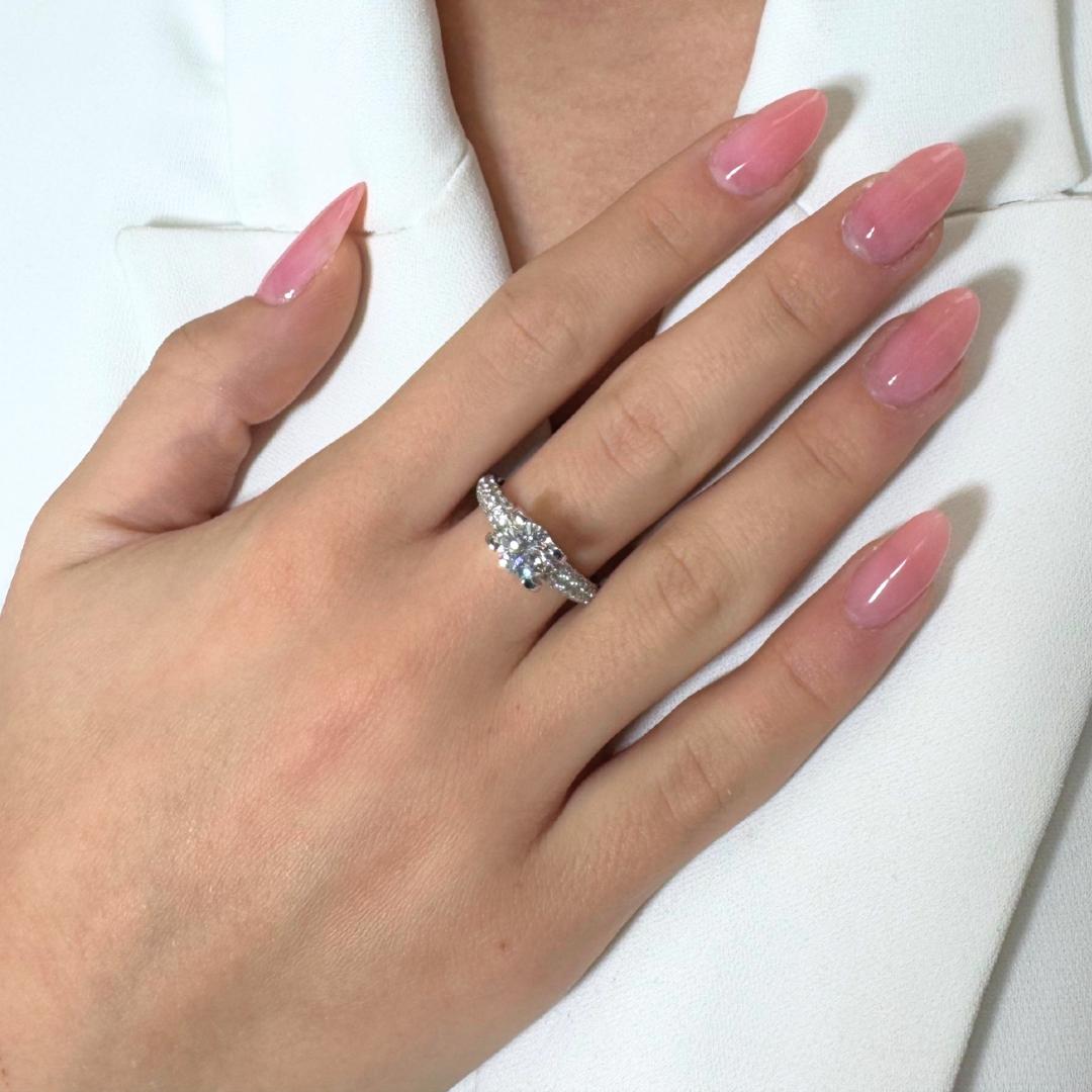 Brilliant 1.75ct Diamonds Pave Ring in 18k White Gold - IGI Certified

This dazzling ring is a celebration of brilliance and precision. At its center lies a 1.00ct round diamond of exceptional color and clarity, promising near-perfection. The