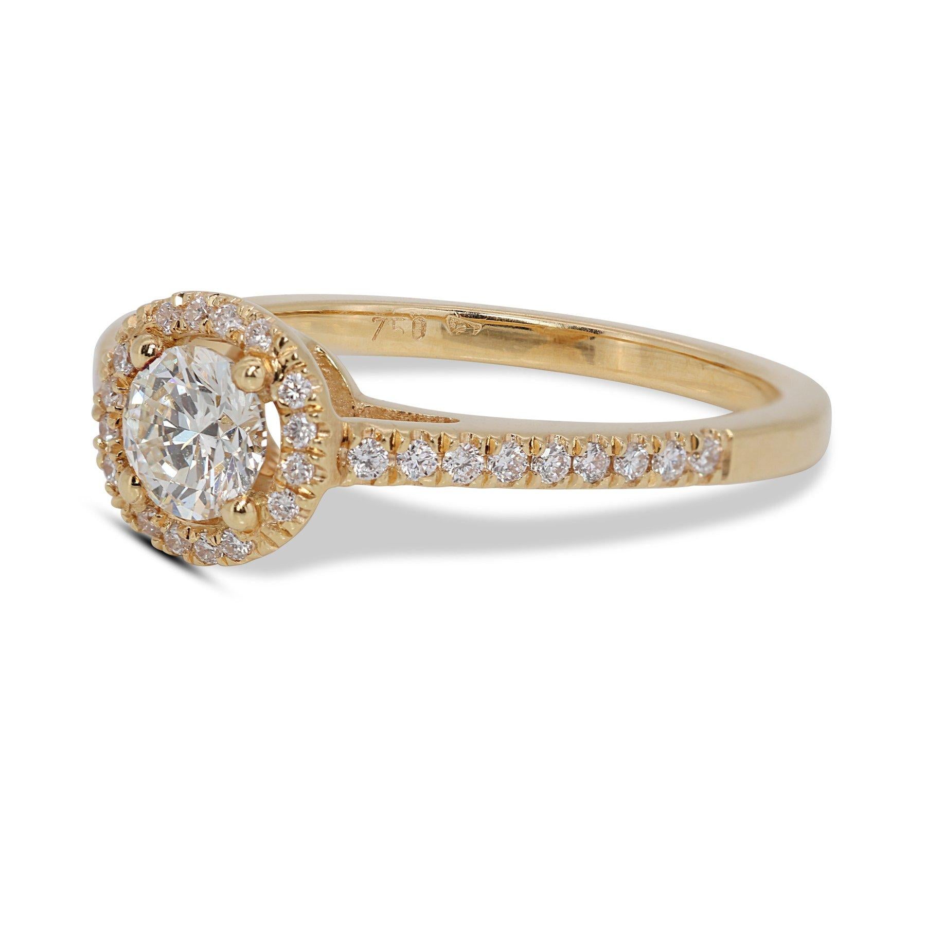 Brilliant 18K Yellow Gold Natural Diamond Halo Ring w/0.93 Carat - GIA Certified

A captivating diamond halo ring featuring a 0.70 carat center stone with a brilliant cut. This dazzling centerpiece is complemented by a sparkling halo of 34 round
