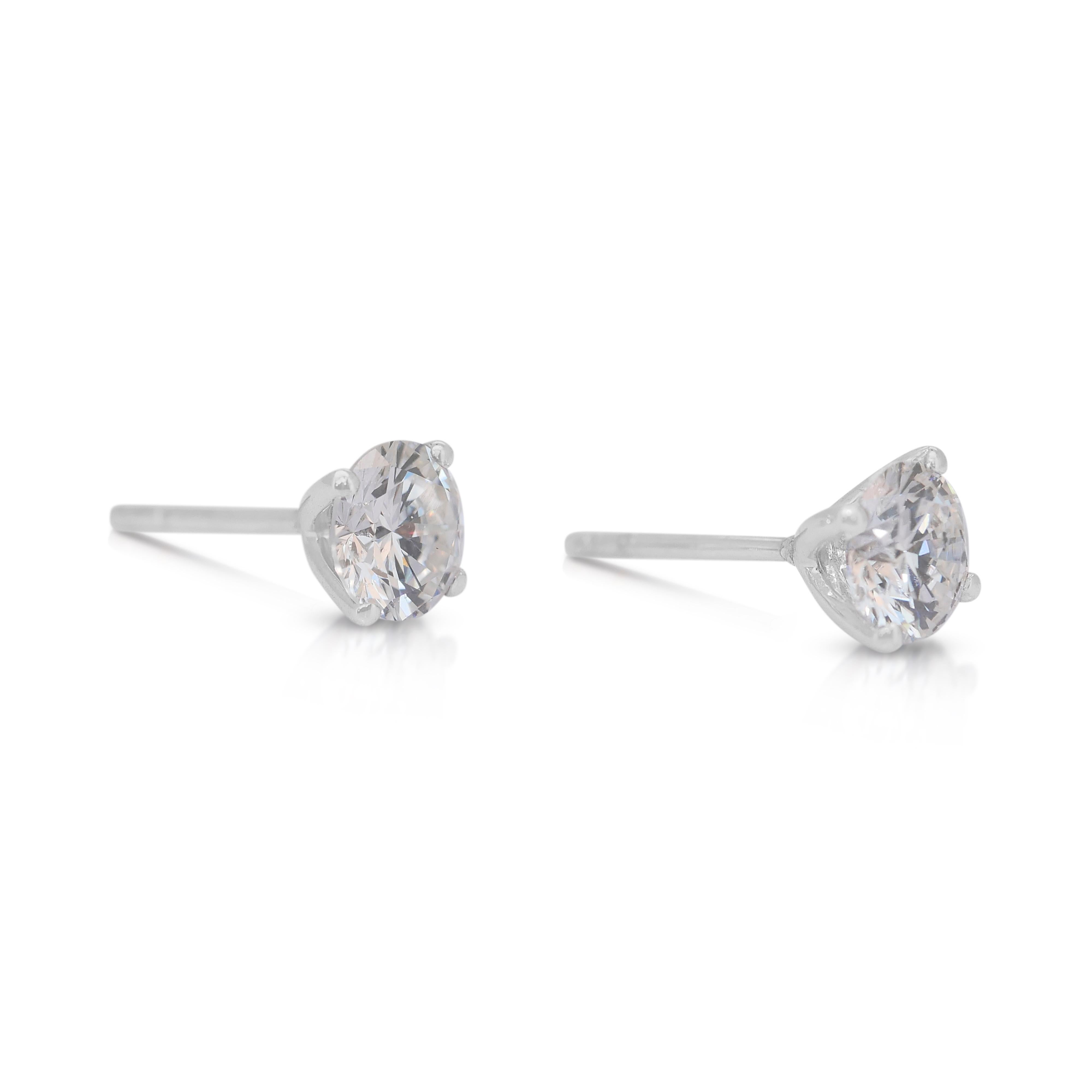 Brilliant 2.05ct Diamonds Stud Earrings in 18k White Gold - IGI Certified

Elevate your elegance with these stunning diamond stud earrings, set in radiant 18k white gold. Featuring two exquisite round diamonds with a combined carat weight of 2.05ct,