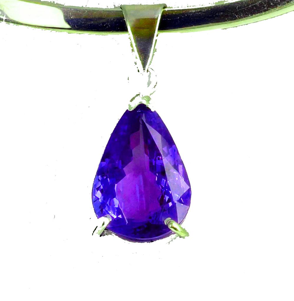 This gorgeous glittering pear shaped Tanzanite is 6.91 carats and drops approximately 1 inch long in this elegant sterling silver pendant.  There are no eye visible inclusions in this magnificent Tanzanite.  The Tanzanite is 16 mm x 11.5 mm.