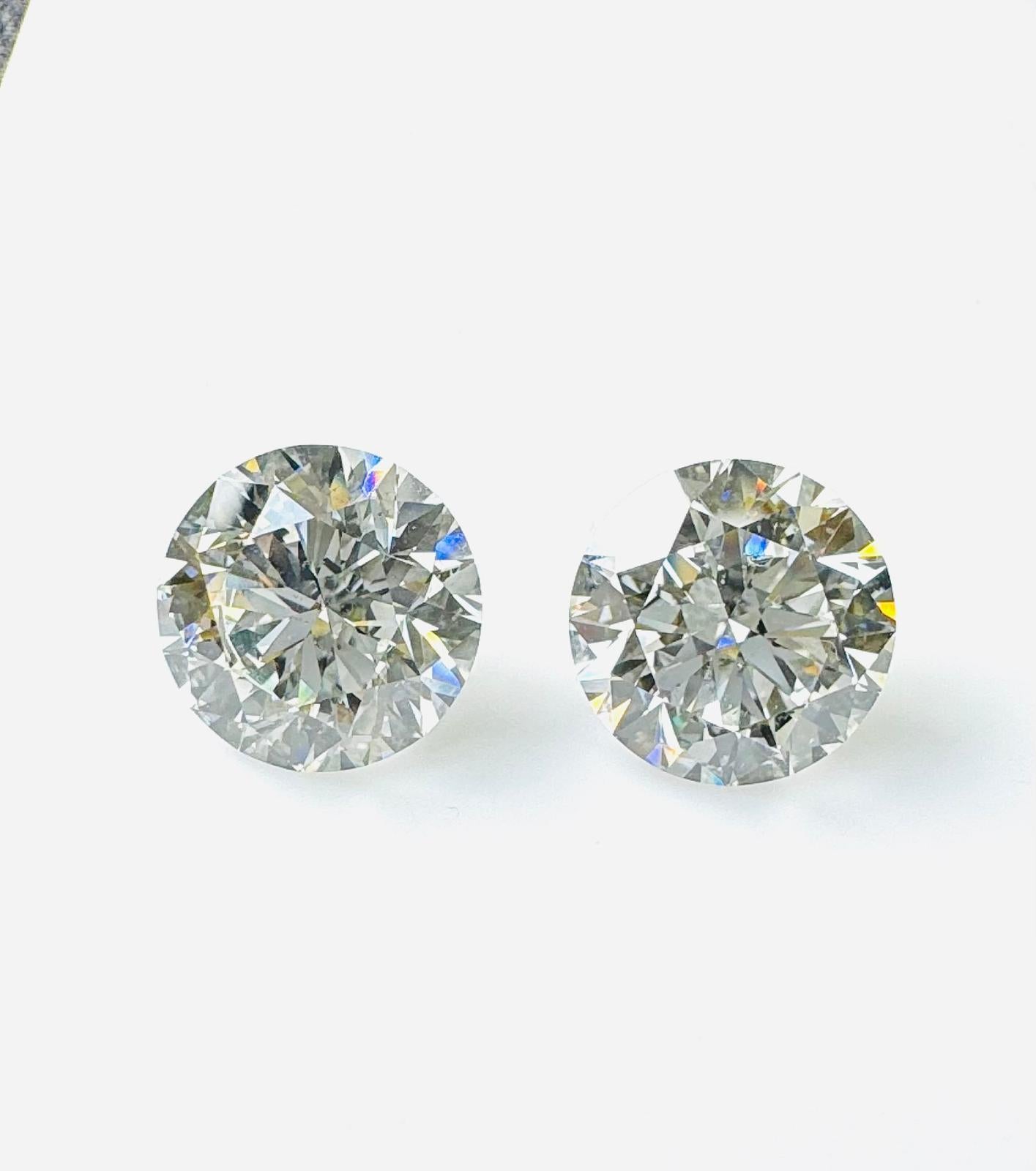 Brilliant 8.26ct Pair of Round-Shaped Diamonds - GIA Certified

Elevate your jewelry collection with this breathtaking pair of round brilliant diamonds totaling 8.26 carats. Each stone boasts a triple excellent ideal cut, ensuring unmatched sparkle