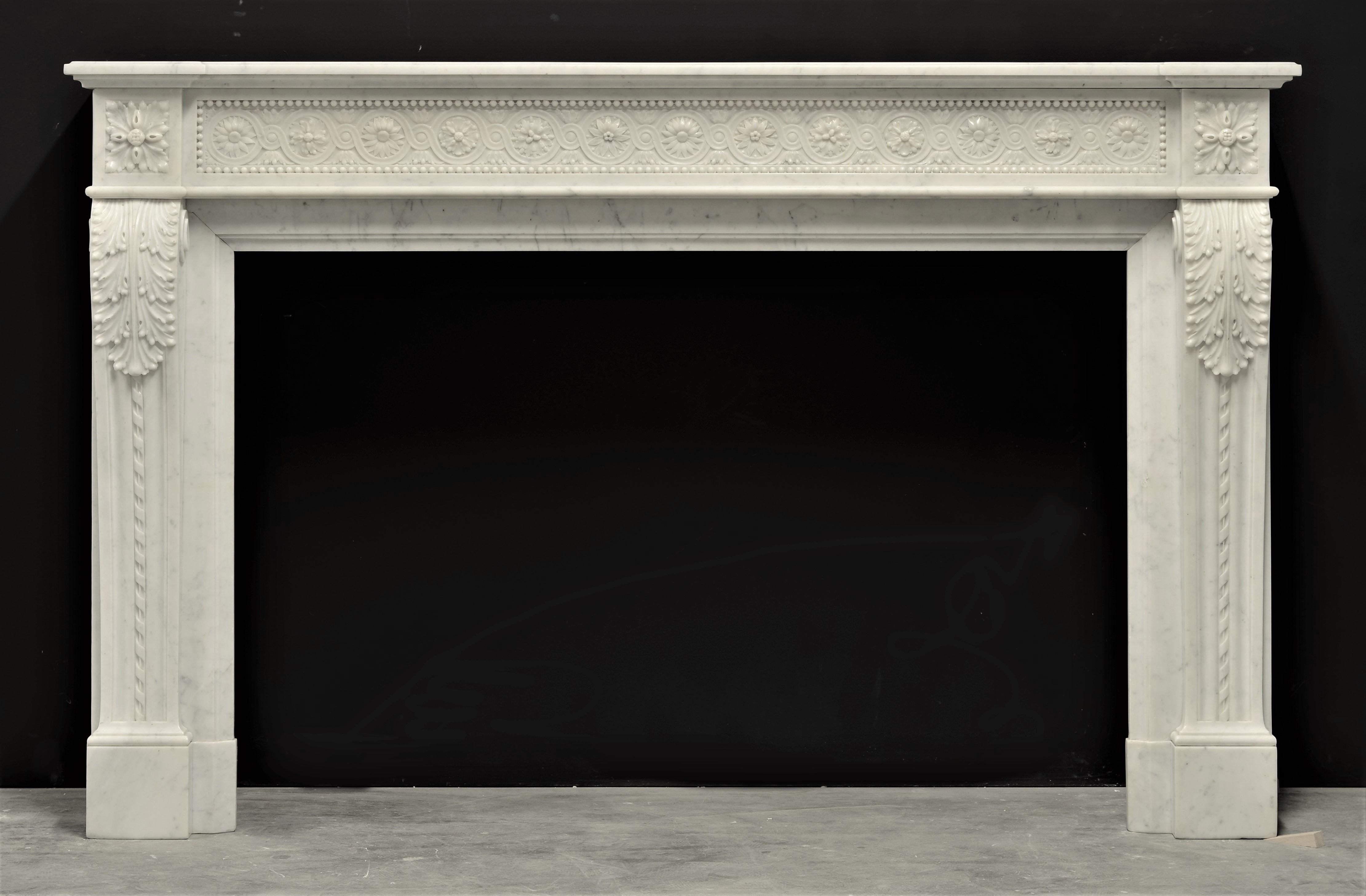 Brilliant antique Louis XVI style fireplace mantel in Carrara white marble

This antique mantel is craved from the finest white marble from Carrara, Italy. It's stunning paneled frieze is decorated with an intertwining guilloche centered with