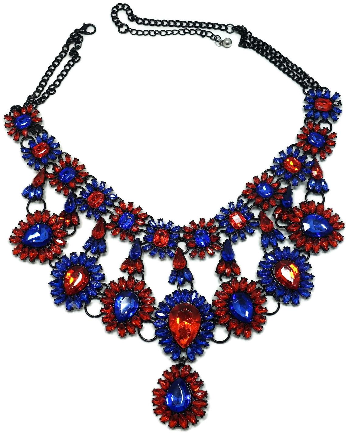 This stunning bib necklace features brilliant blue and orange color crystals in a Japanned setting.  In excellent condition, this necklace measures 24” with a spring closure; the center drop is 4-1/2” top to bottom.