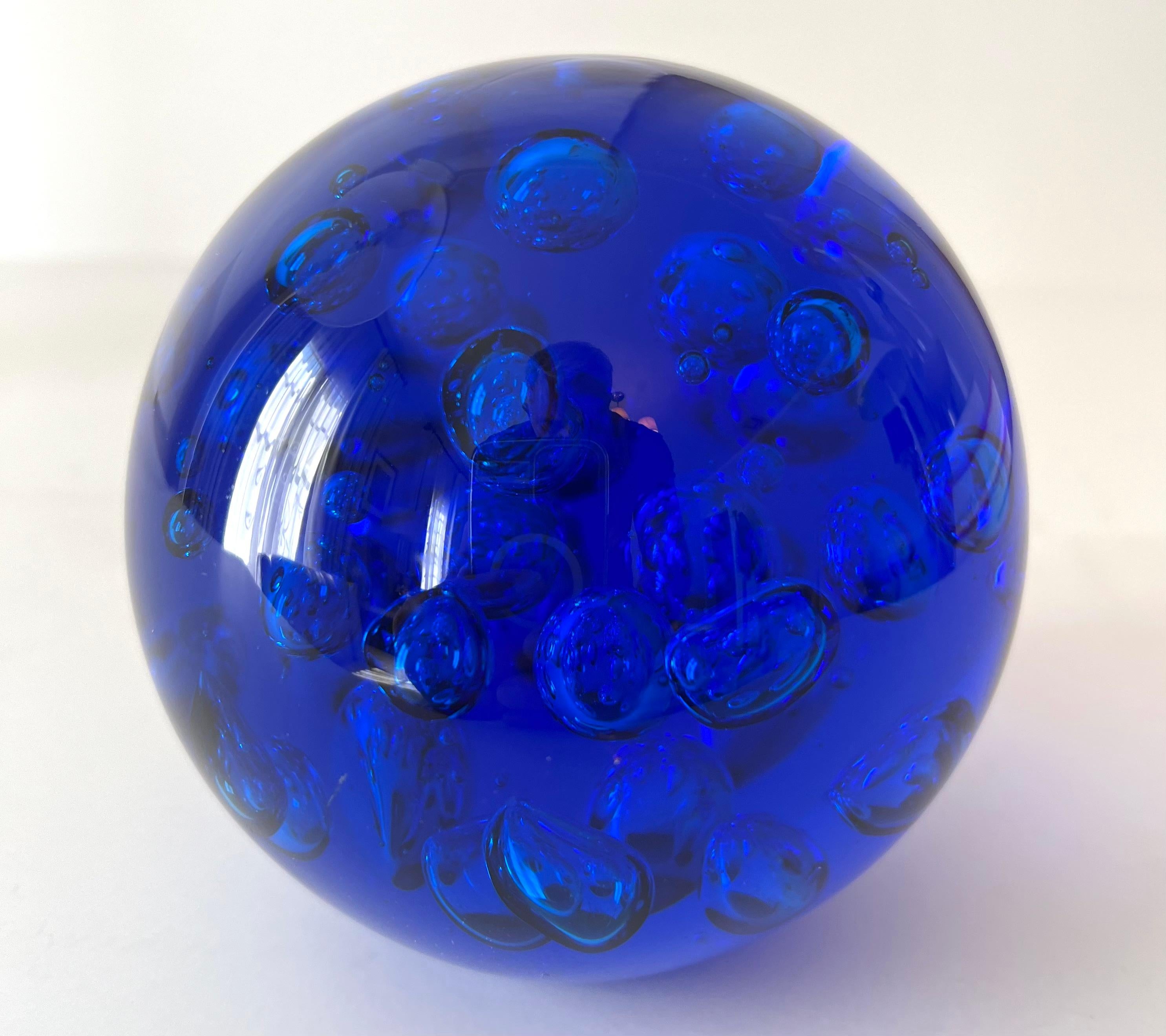 A brilliant cobalt Blue hand Blown glass paperweight. The color and size are very nice... the weight is heavy and substantial - great for paperweight or as a decorative object.

Not easily found, this is a unique piece and will definitely stand