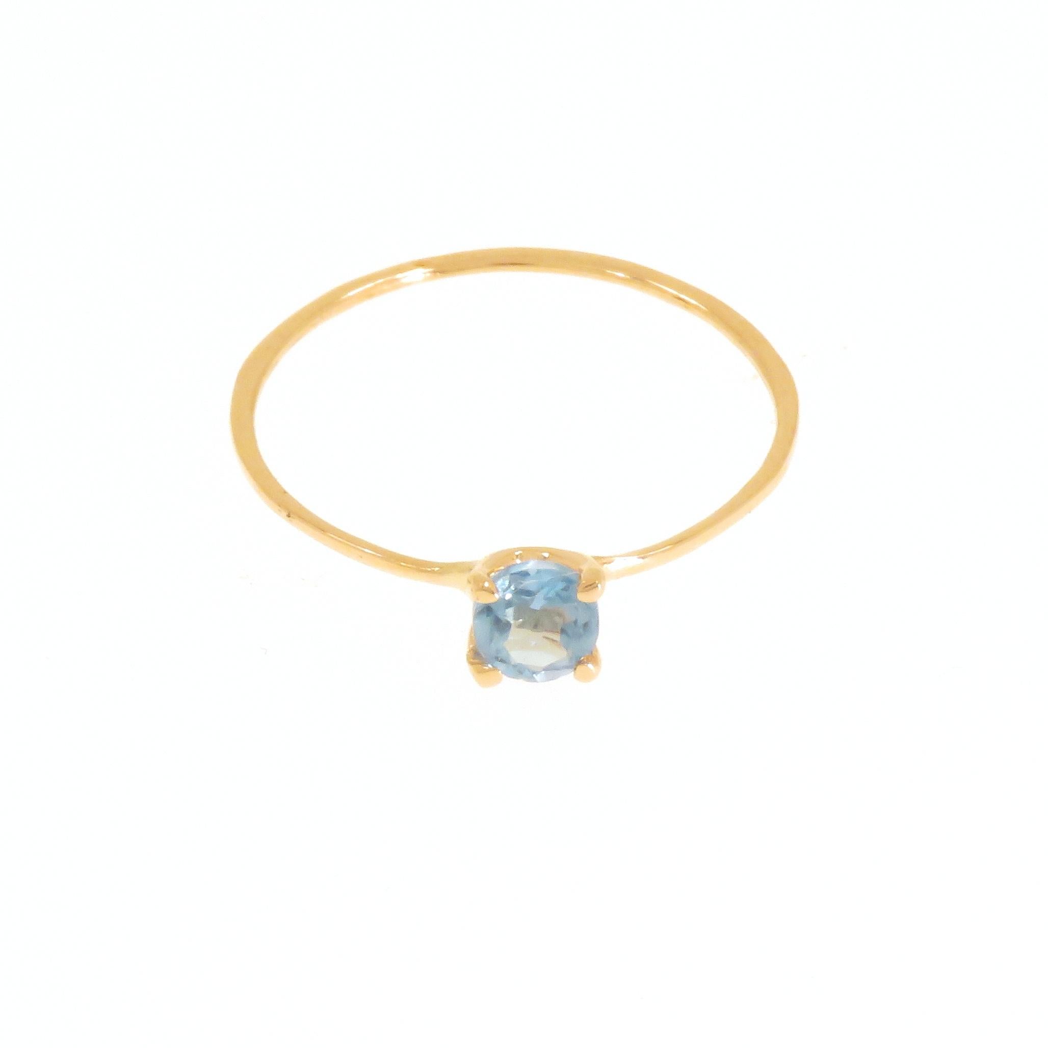 Stacking ring handmade in 9 carat rose gold with brilliant cut blue topaz, diameter 0.157 inches. Finger size: US size 6, Italian size 12, UK size M 1/2, French size 52. The ring can be re-sized to the customer's size before shipping. Total weight: