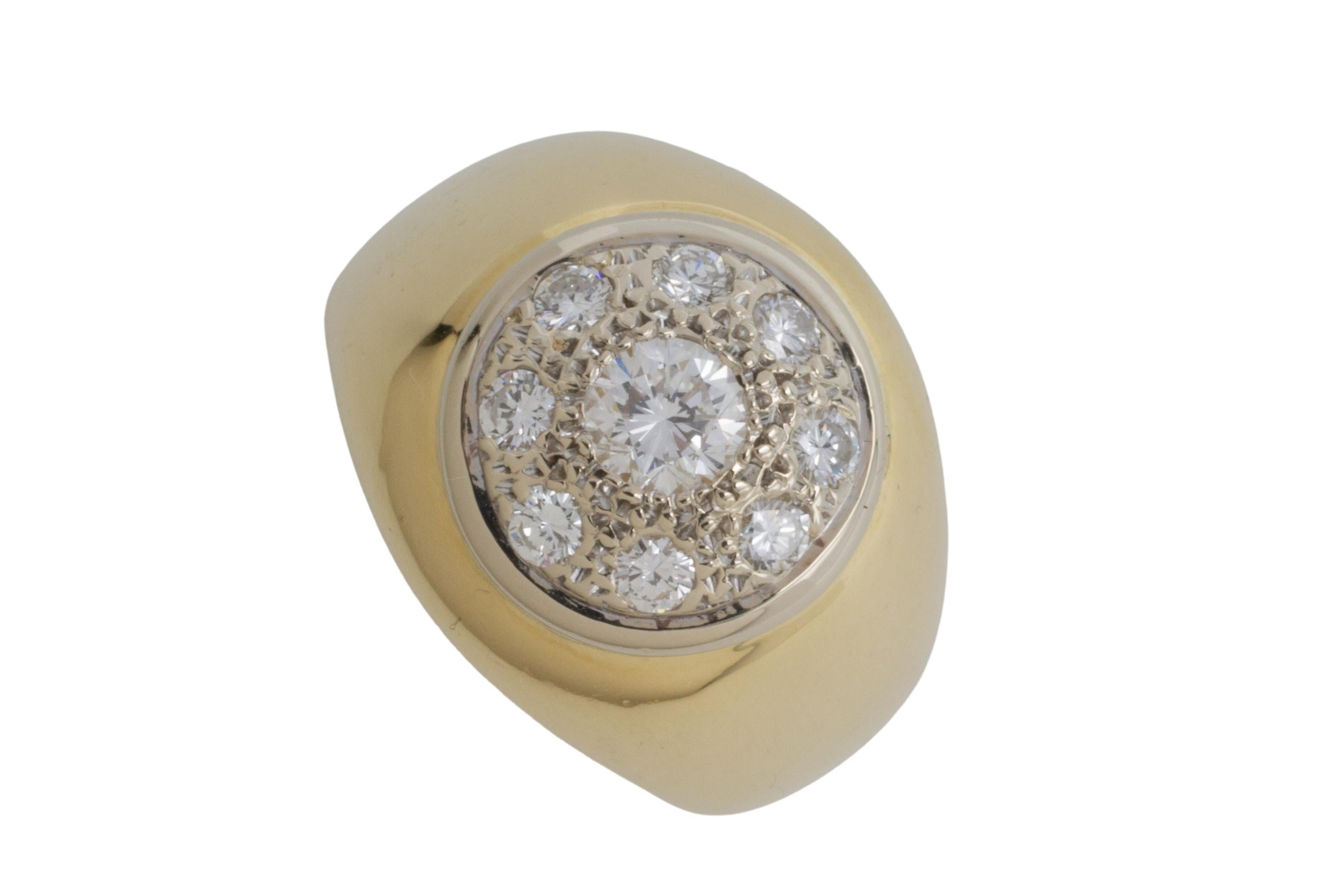 An impressive 18 karat yellow gold ring with 9  brilliant cut diamonds in a pave set white gold diamond cluster.

The diamonds are .91 carat in total, VS in quality and G in color. 

The white gold setting has a diameter of 12 mm, the ring is 17 mm