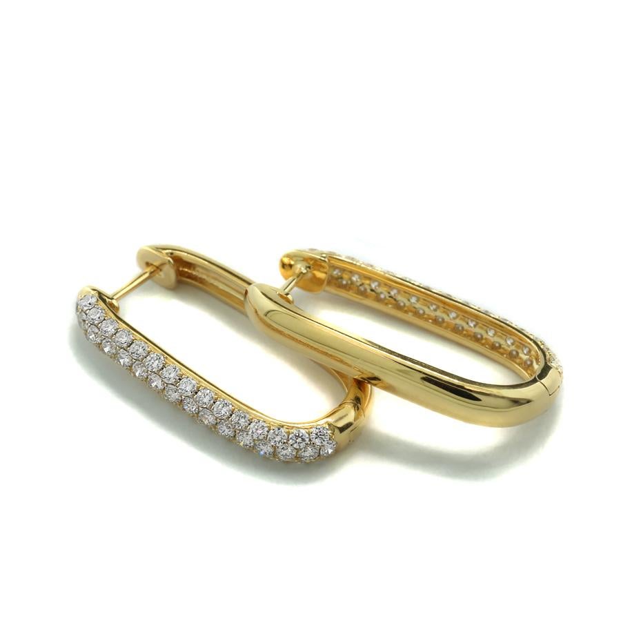 Earrings that combine modern elegance with timeless brilliance: slim rectangular hoops with rounded corners and subtly convex surfaces. The front side is set with 92 white brilliant-cut diamonds totaling approx. 1.41 carats, color: G-H, clarity: VS.