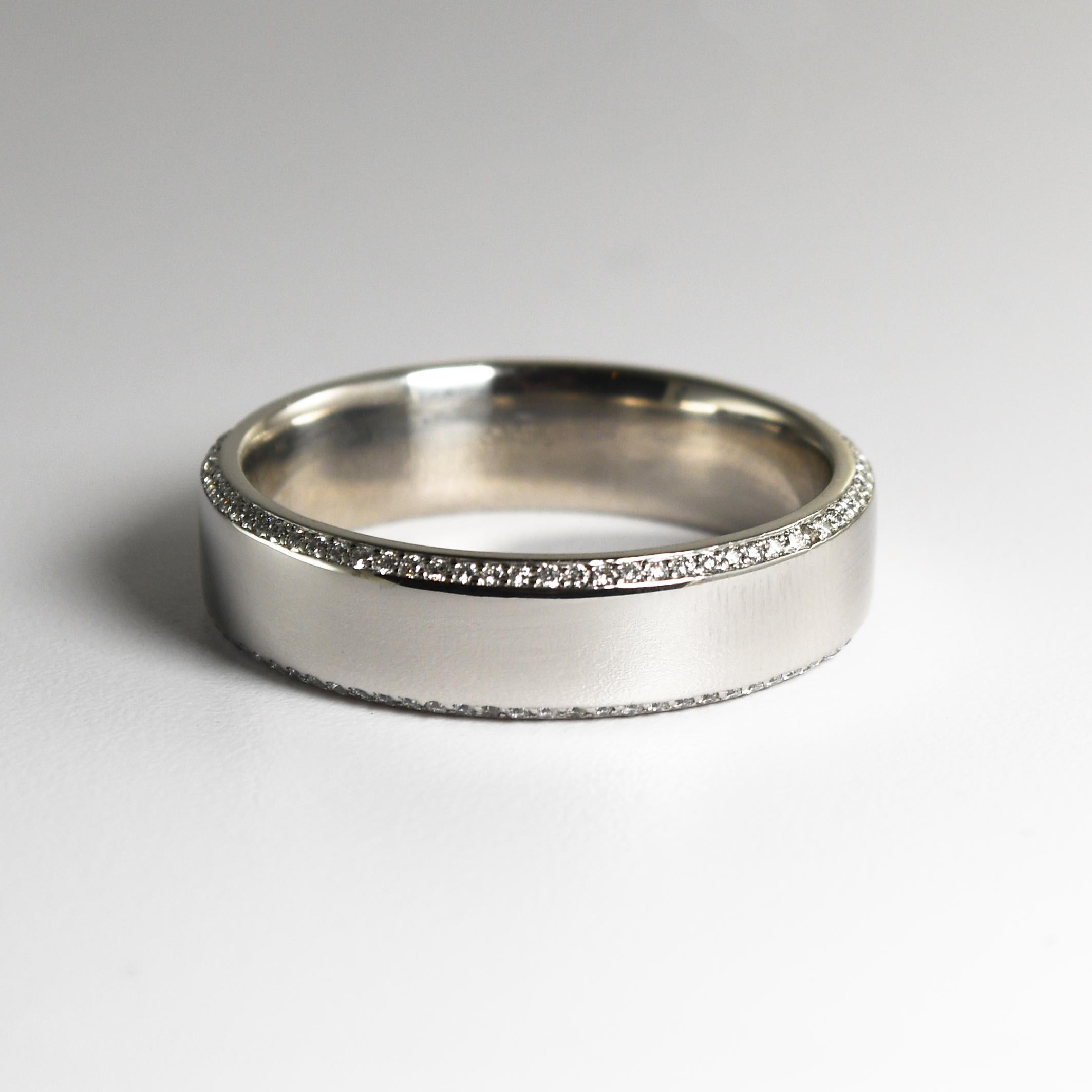 Men's platinum and diamond eternity wedding ring.
Manufactured by Brilliant Earth jewelers, Luxe anthology model.
Stamped Plat. and weighs 16.6 grams.
Tests 98% platinum using a XRF metals analyzer.
There are tiny round brilliant cut diamonds set on
