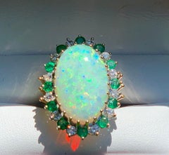 Brilliant Fire 9.6 Carat Oval Opal Diamond and Emerald Halo Two-Tone Gold Ring