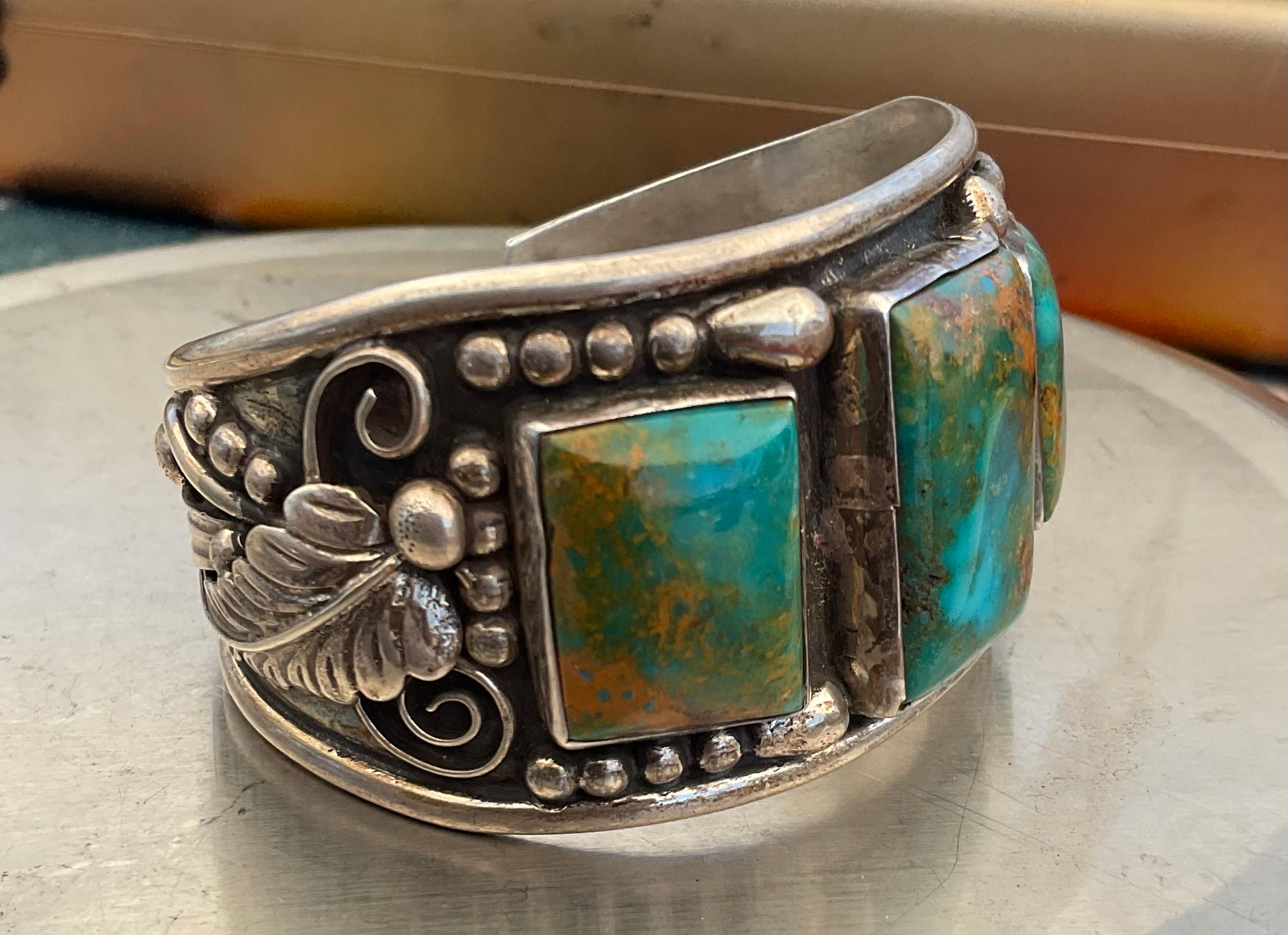 This is another favorite piece of mine which I am proud to bring to 1stdibs. Made by William Singer, the piece boasts three incredible Royston Turquoise stones surrounded by sterling silver beads with a sterling silver feather on each side. Please
