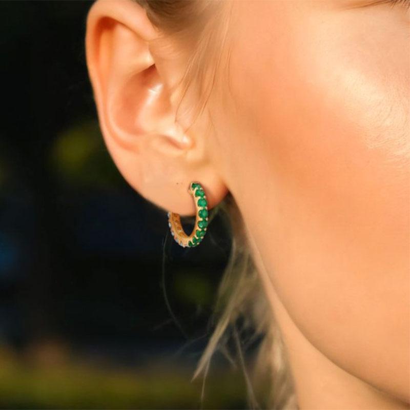 The Brilliant Opal 14K Yellow Gold Huggies Diamond Earrings showcase a captivating blend of natural diamonds, blue sapphires, and emeralds, all set in luxurious 14K yellow gold. With a size of 13MM x 2MM, these earrings strike the perfect balance